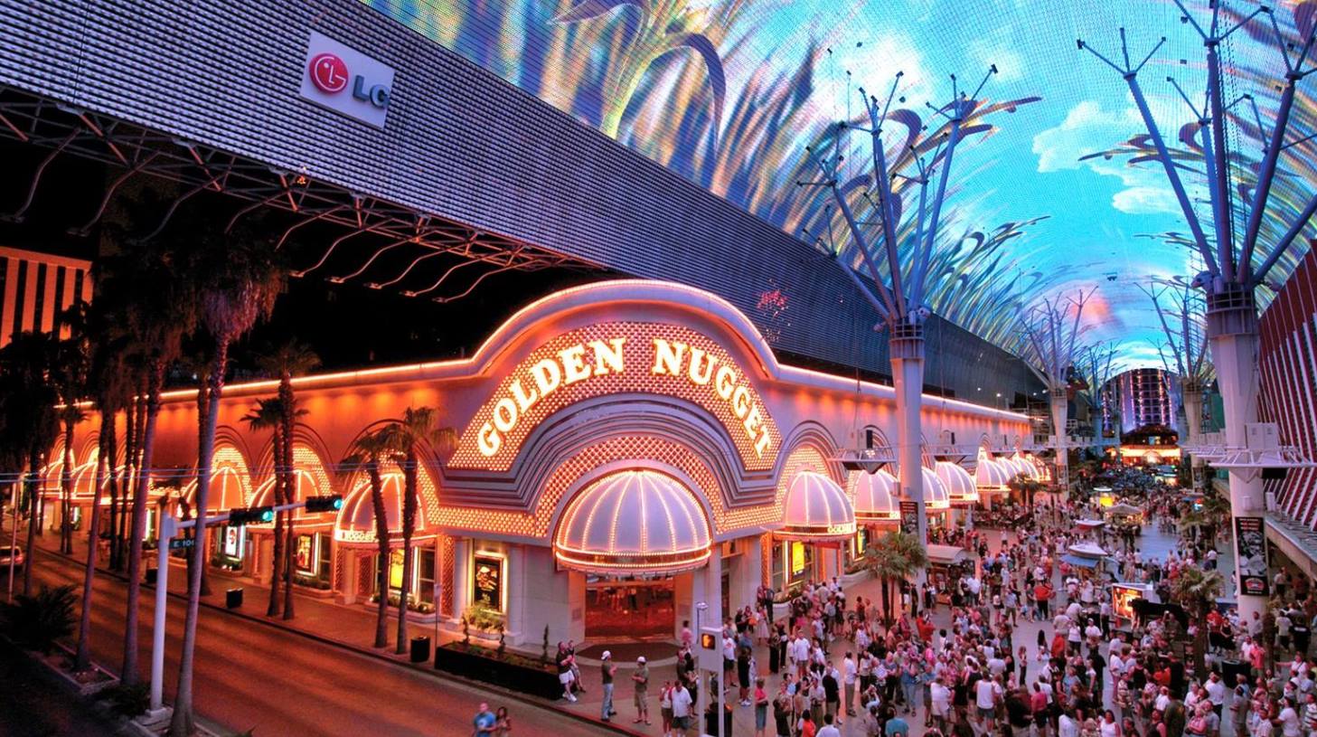The busy western corner entrance and bright signage of the Golden Nugget Las Vegas resort on downtown’s Fremont Street.