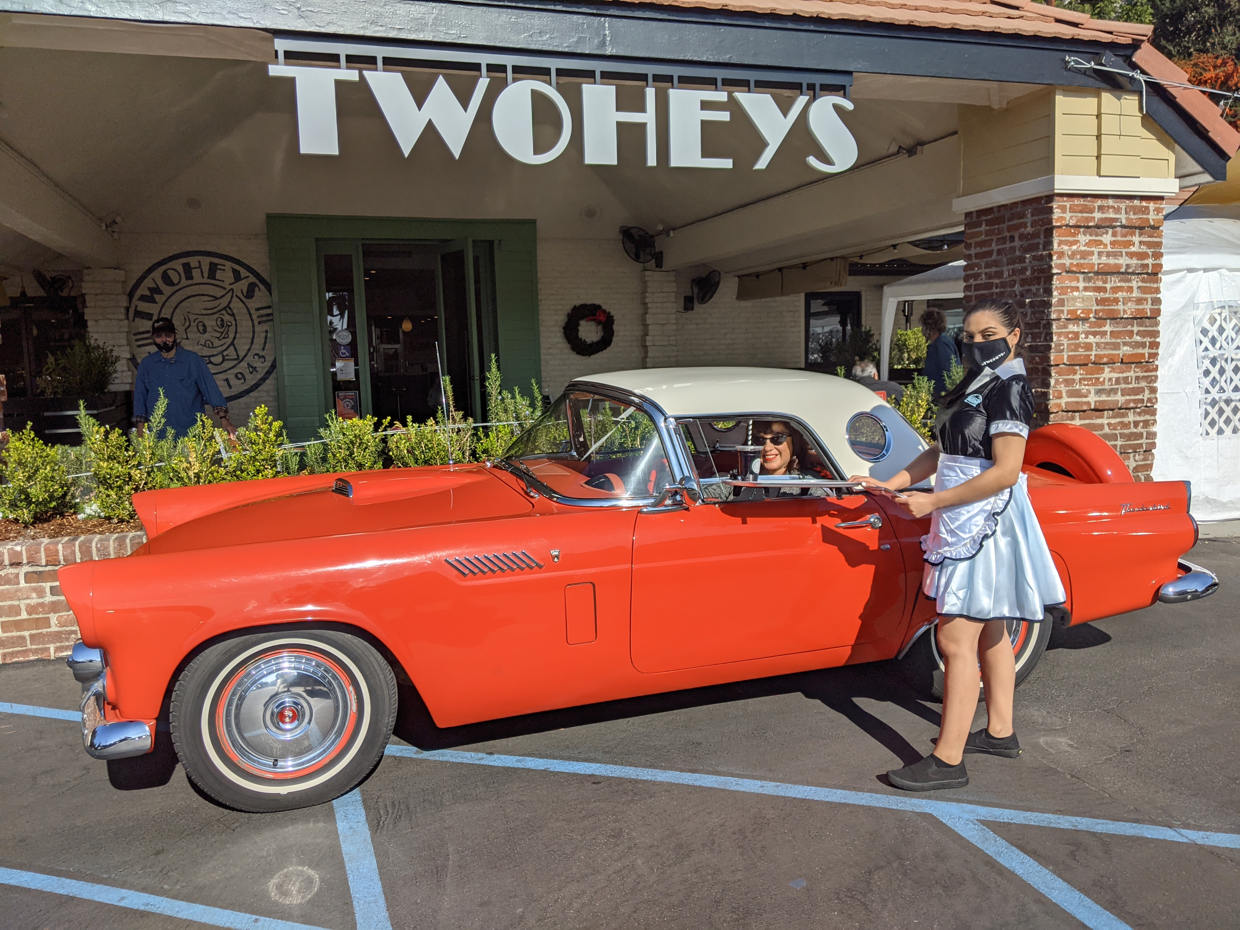 Trompers of Eagle Rock Car Club, the first customers to experience Twohey’s curbside car hop in South Pasadena, California
