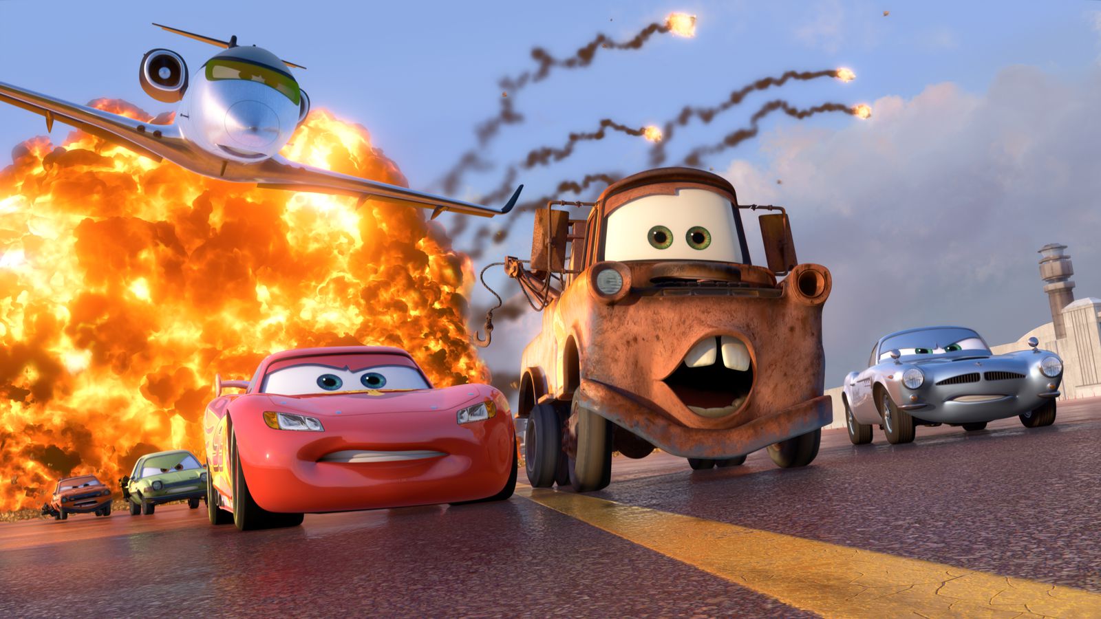 Lightning McQueen and Mater race away from an explosion in Cars 2