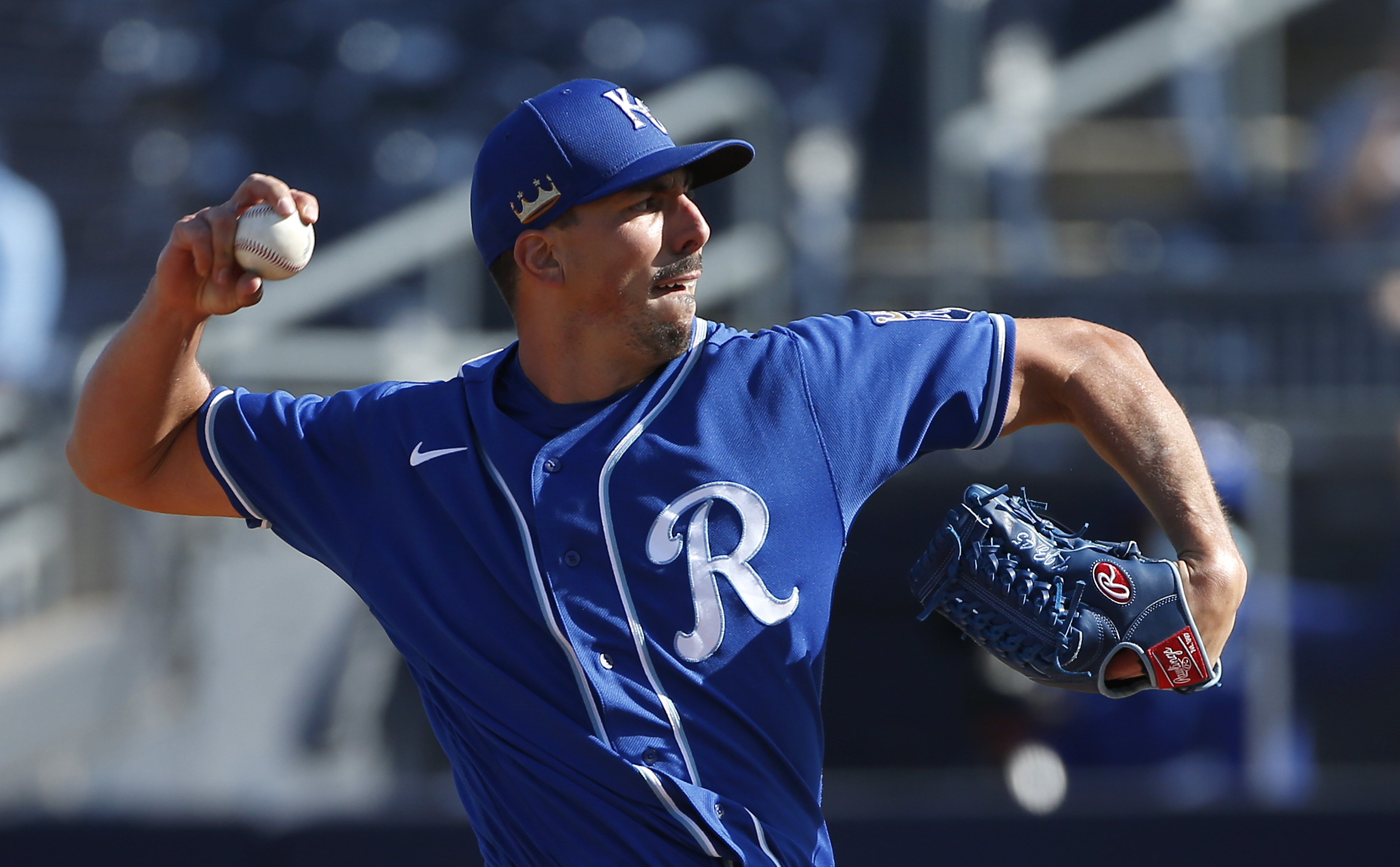 Pitcher Kyle Zimmer #45 of the Kansas City Royals throws against the Seattle Mariners during the eighth inning of the MLB spring training baseball game at Peoria Sports Complex on March 09, 2021 in Peoria, Arizona.