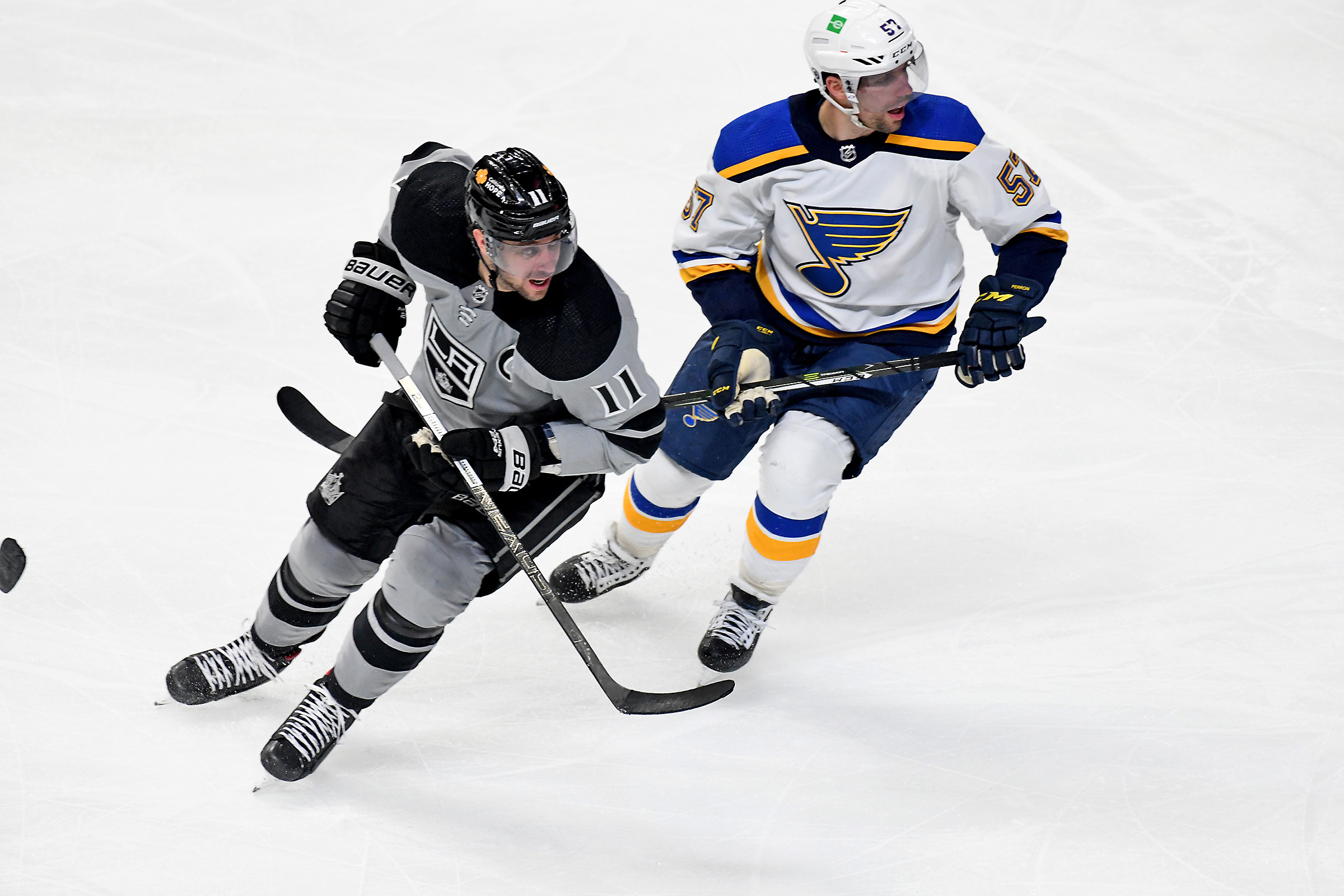 Los Angeles Kings Center Anze Kopitar (11) and St. Louis Blues Right Wing David Perron (57) watch play during a National Hockey League game at the Staples Center in Los Angeles, CA.
