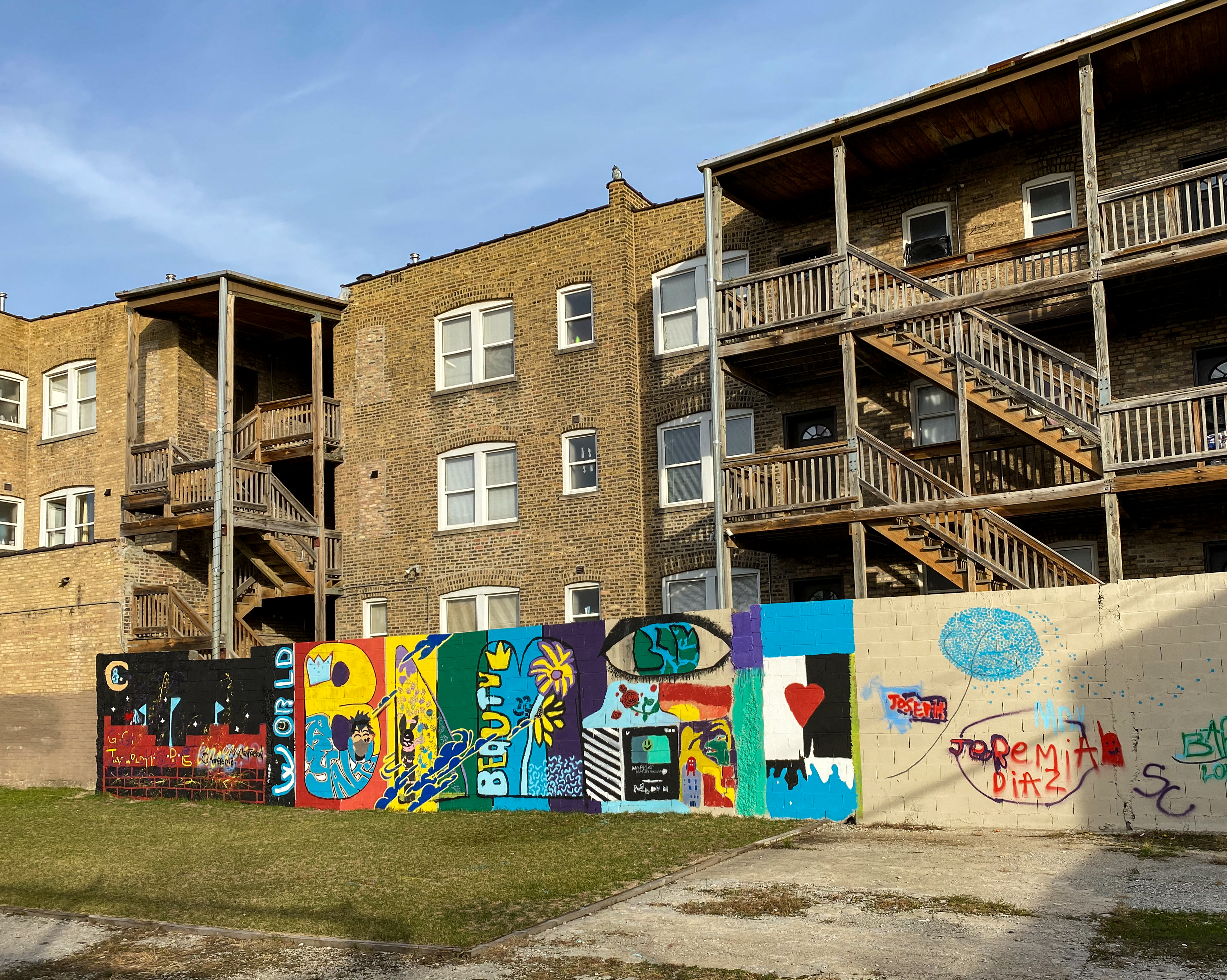This mural, painted on wall outside apartments near Division Street and Springfield Avenue., was designed and mostly done by middle school students.