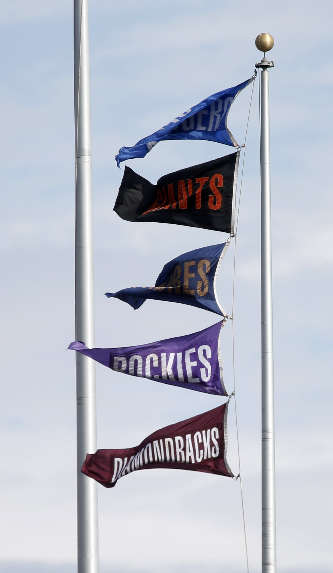 The flags at AT&amp;T Park indicate the final regular season standings in the National League West after the San Francisco Giants defeated the San Diego Padres in San Francisco, Calif., on Sunday, Sept. 28, 2014. (Karl Mondon/Bay Area News Group