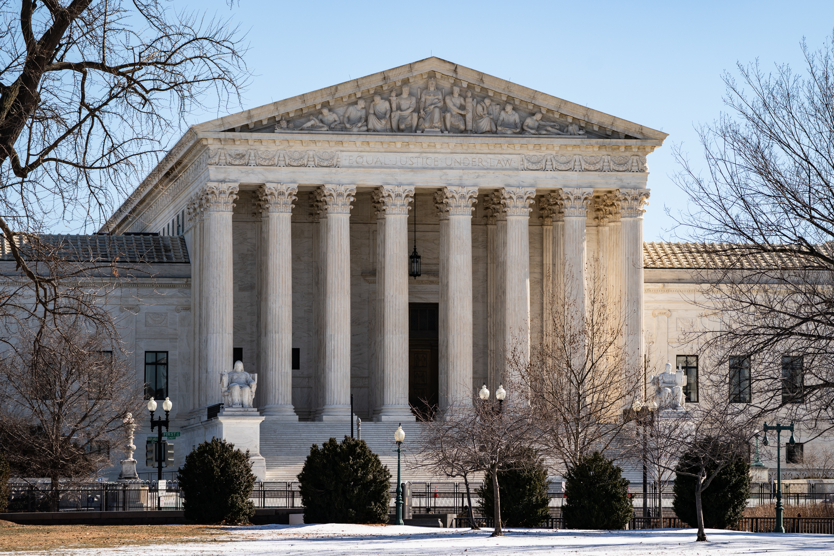 A picture of the United States Supreme Court. Barricades are seen that were erected after the January 6 attack on the US Capitol building.