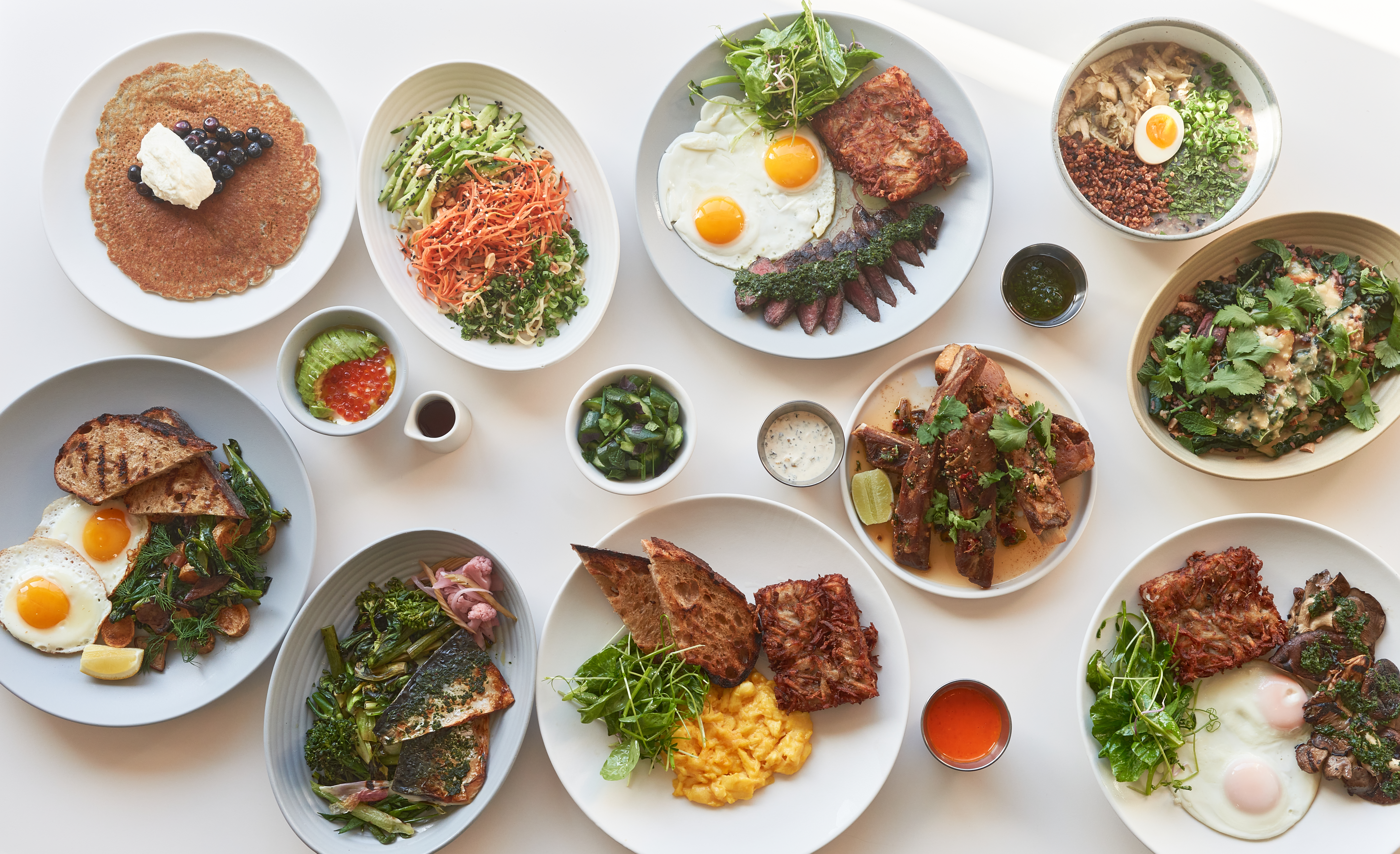 A collection of brunch dishes like pancakes, and steak and eggs at Yang’s Kitchen.