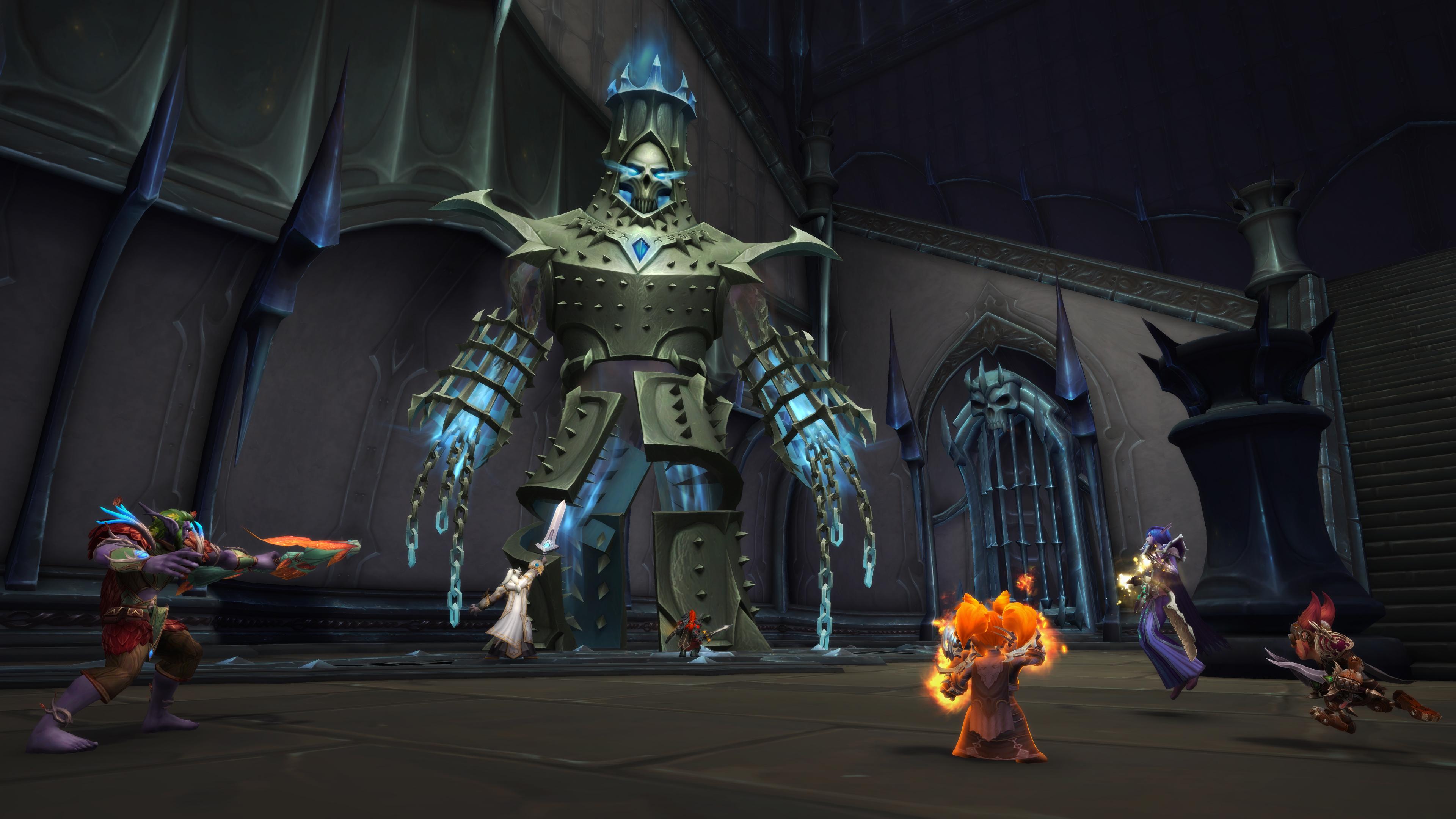 World of Warcraft - A group of players attacks a giant, armored minion of the nefarious Jailer in The Maw.