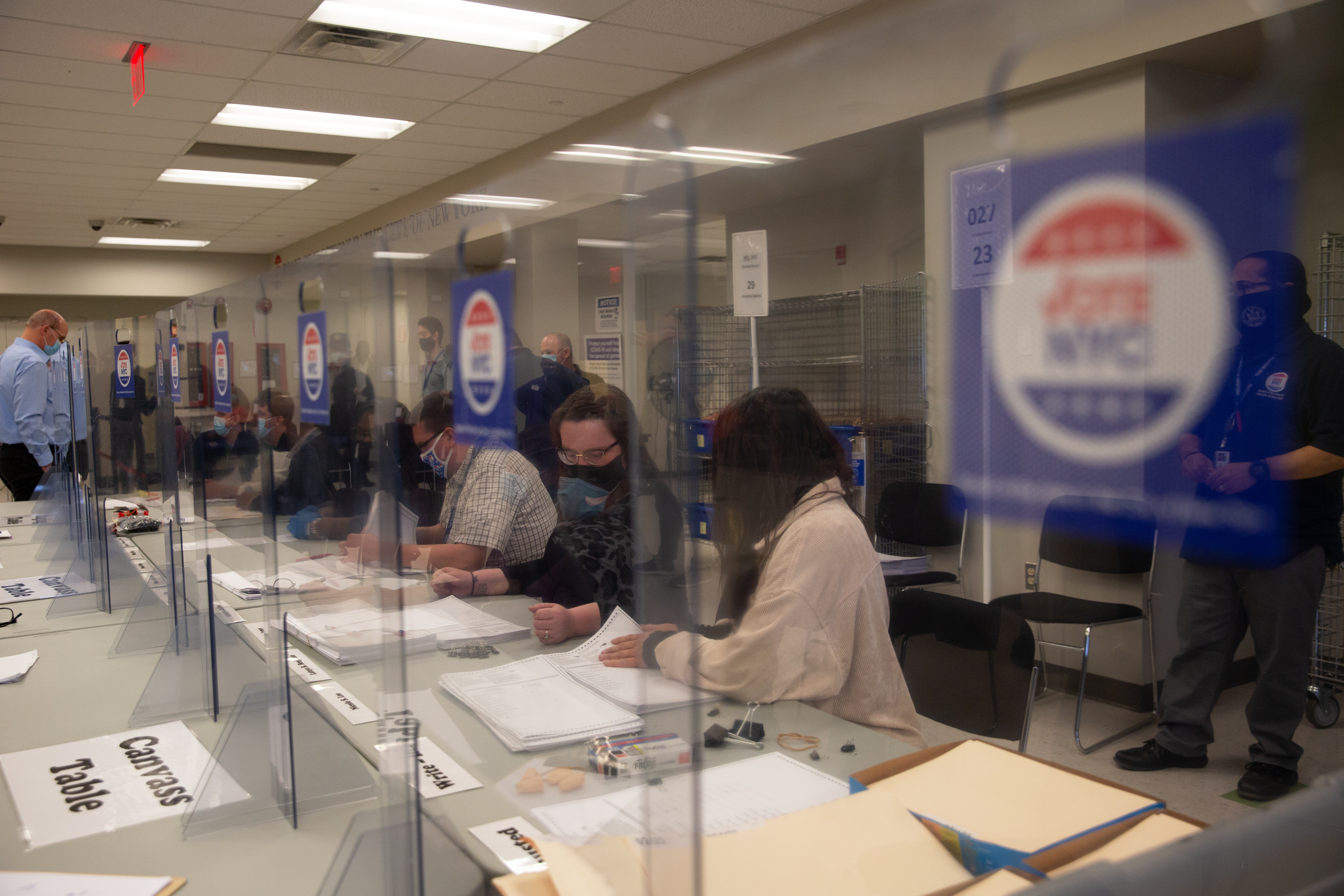 Board of Elections workers tally ballots for the Council District 31 special election in Queens, March 16, 2021.