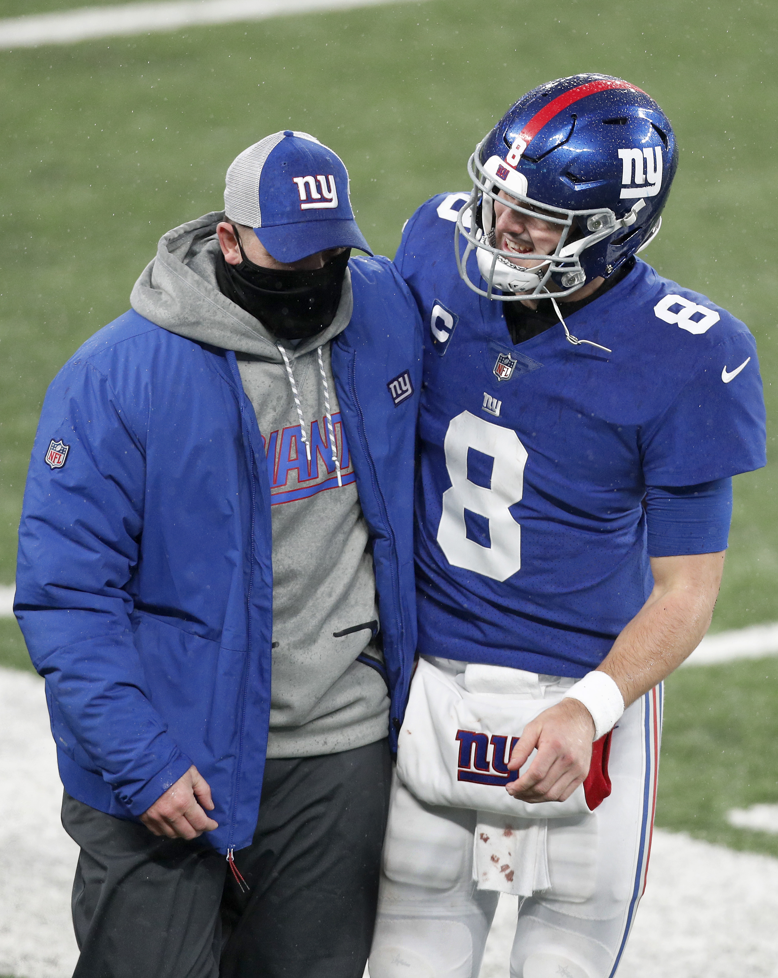 Head coach Joe Judge and Daniel Jones #8 of the New York Giants walk off the field after a game against the Dallas Cowboys at MetLife Stadium on January 03, 2021 in East Rutherford, New Jersey.