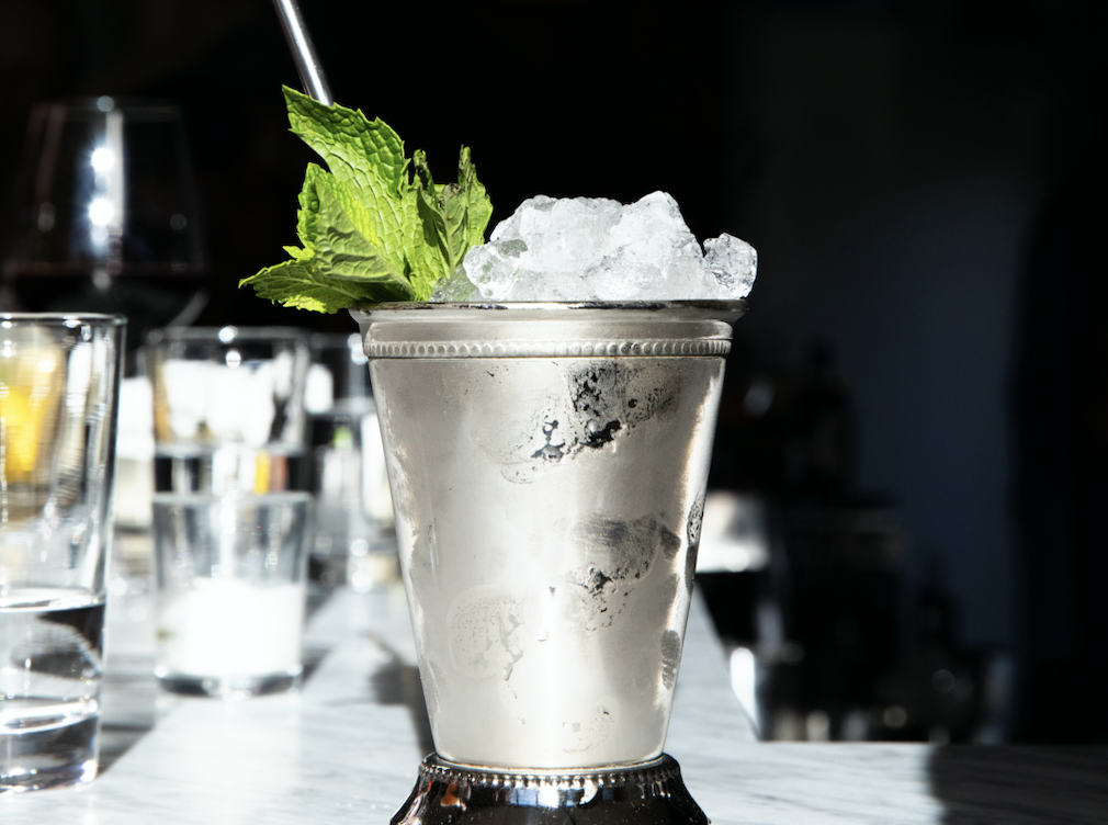 A mint julep in a sterling silver glass at Seattle cocktail bar Baker’s