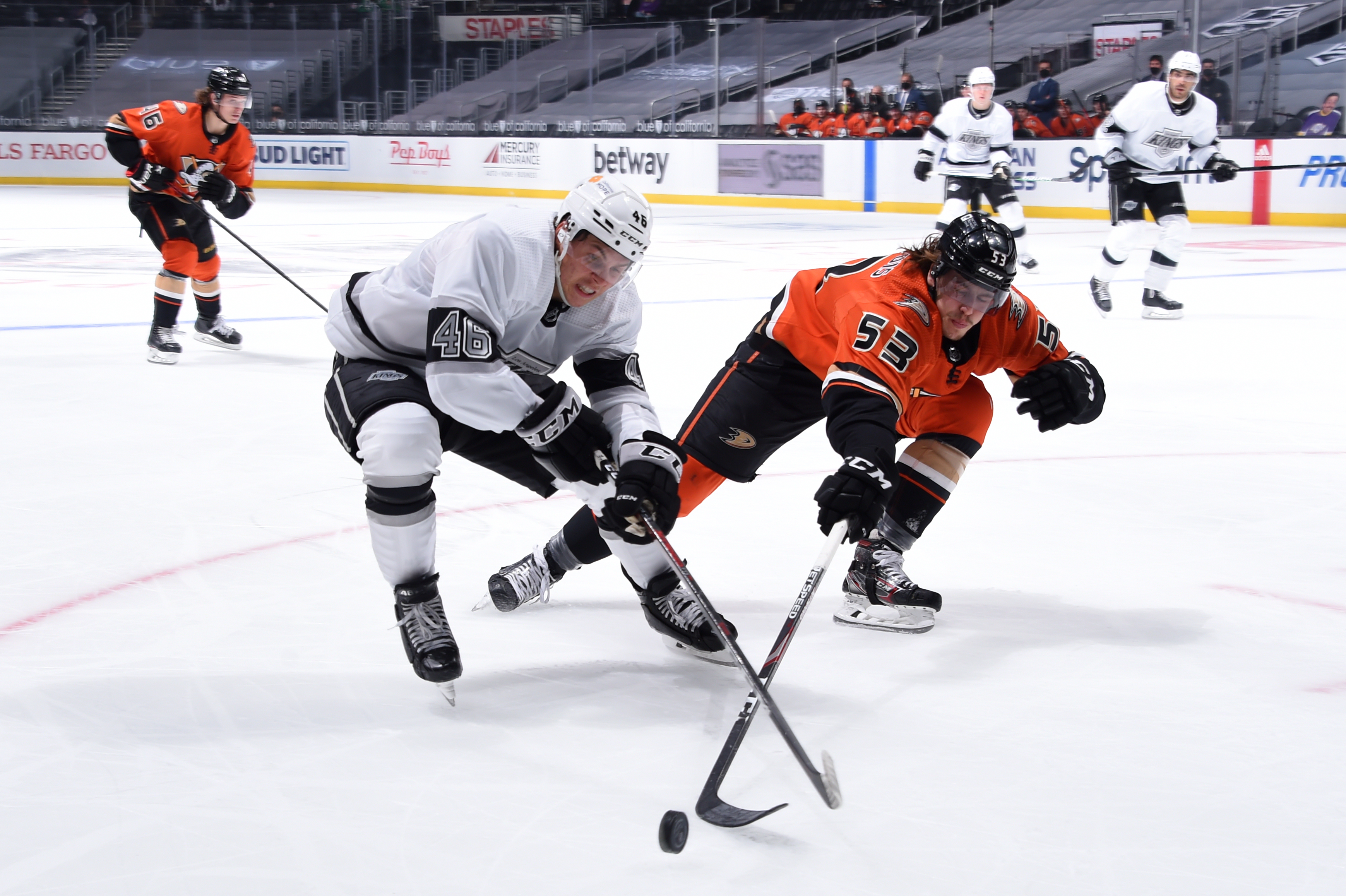 #46 of the Los Angeles Kings and Max Comtois #53 of the Anaheim Ducks battle for the puck during the second period at STAPLES Center on April 28, 2021 in Los Angeles, California.