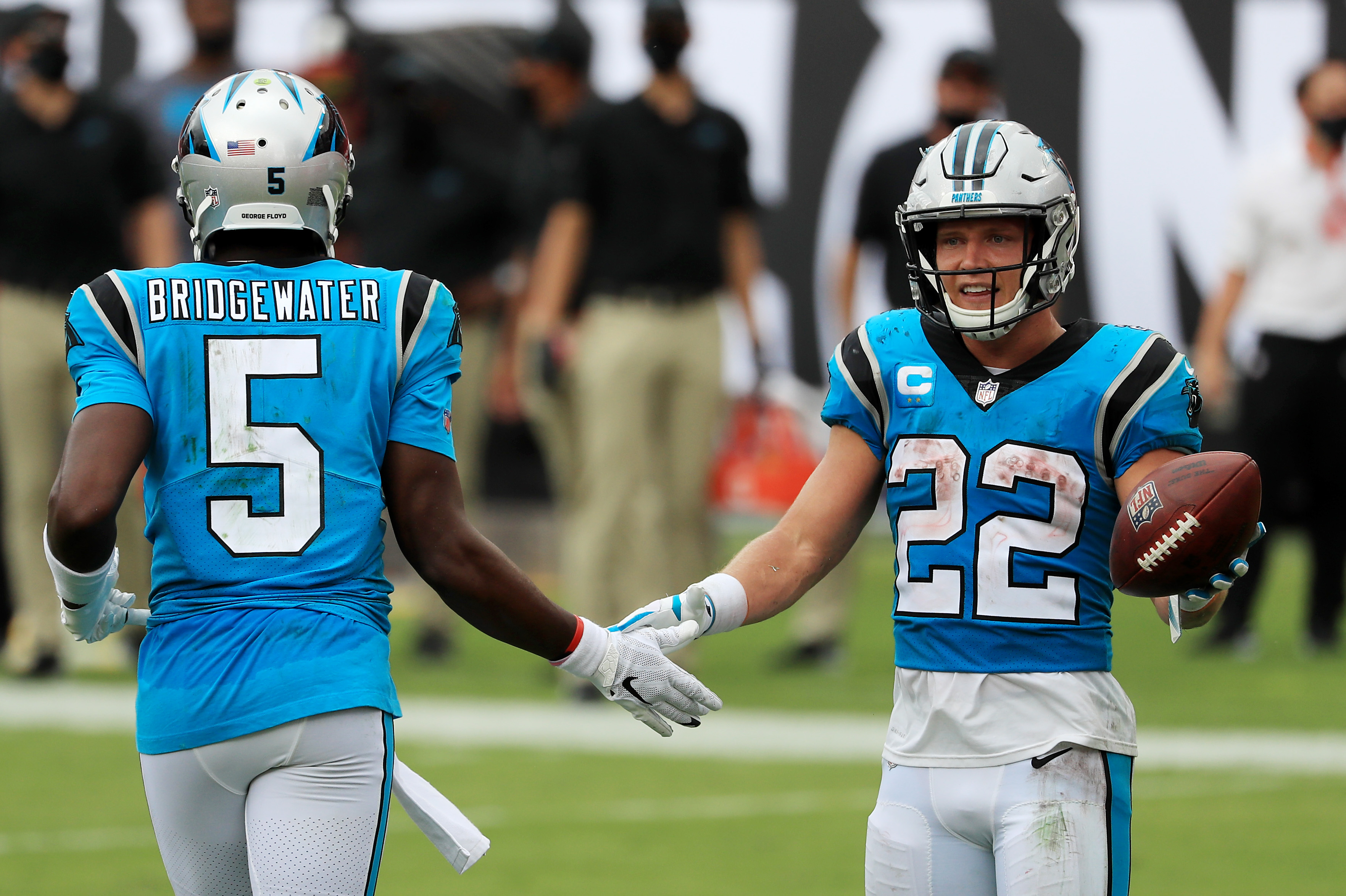 Christian McCaffrey #22 of the Carolina Panthers celebrates with Teddy Bridgewater #5 after scoring a touchdown during the third quarter against the Tampa Bay Buccaneers at Raymond James Stadium on September 20, 2020 in Tampa, Florida.