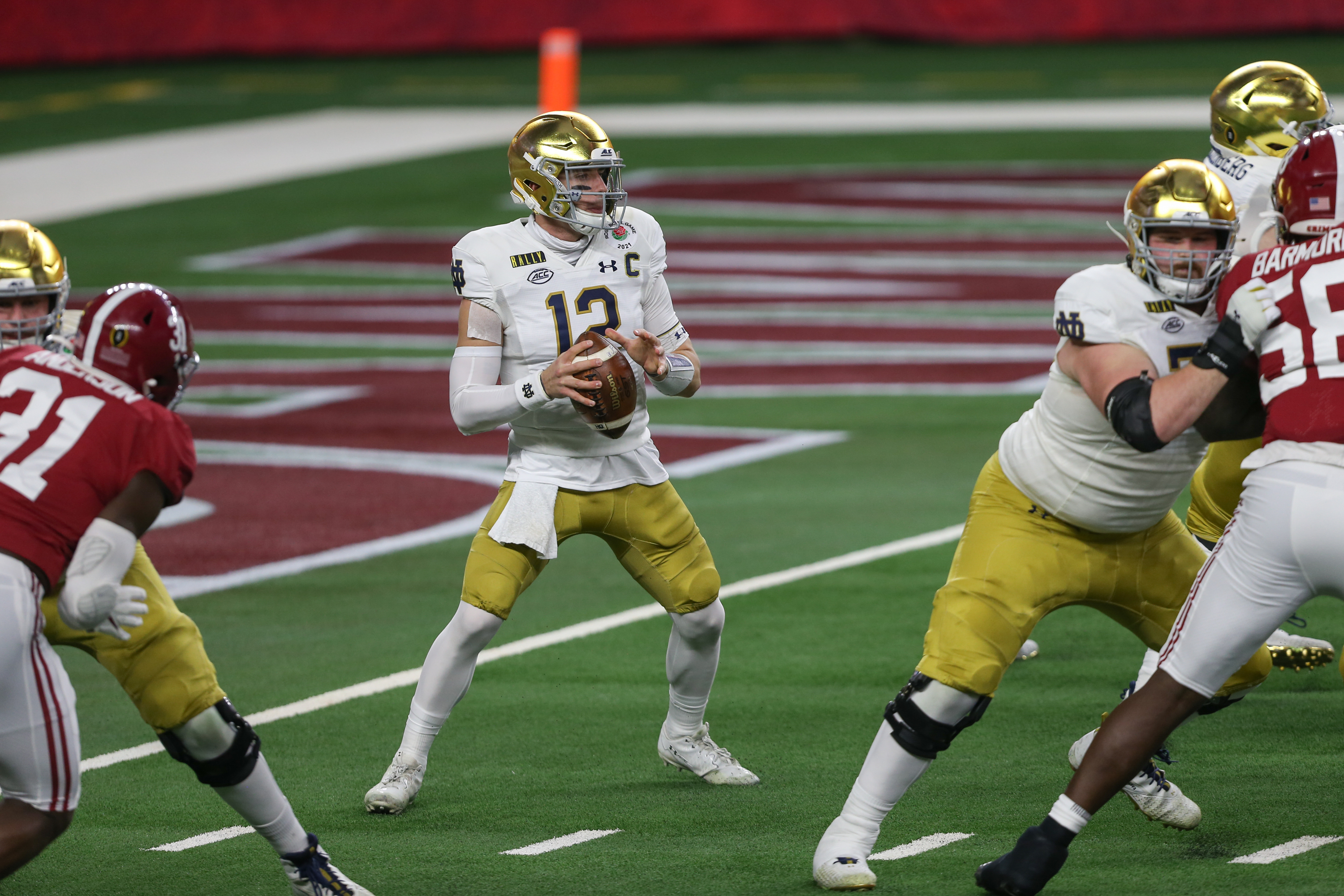 Notre Dame Fighting Irish quarterback Ian Book (12) passes during the College Football Playoff Semifinal Rose Bowl Game between Notre Dame and Alabama on January 1, 2021 at AT&amp;T Stadium in Arlington, TX.