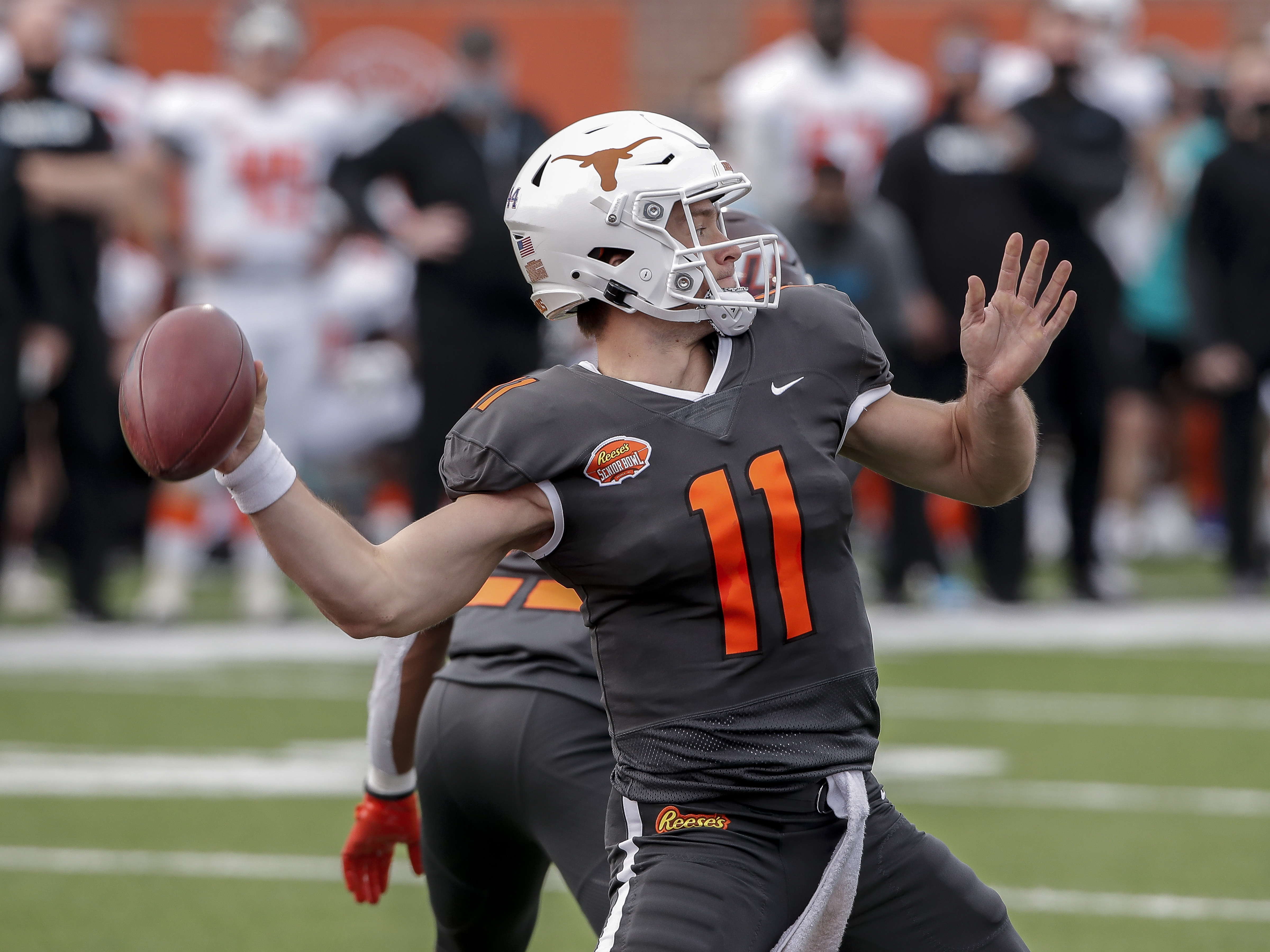 Quarterback Sam Ehlinger #11 from Texas of the National Team on a pass play during the 2021 Resse’s Senior Bowl at Hancock Whitney Stadium on the campus of the University of South Alabama on January 30, 2021 in Mobile, Alabama. The National Team defeated the American Team 27-24.