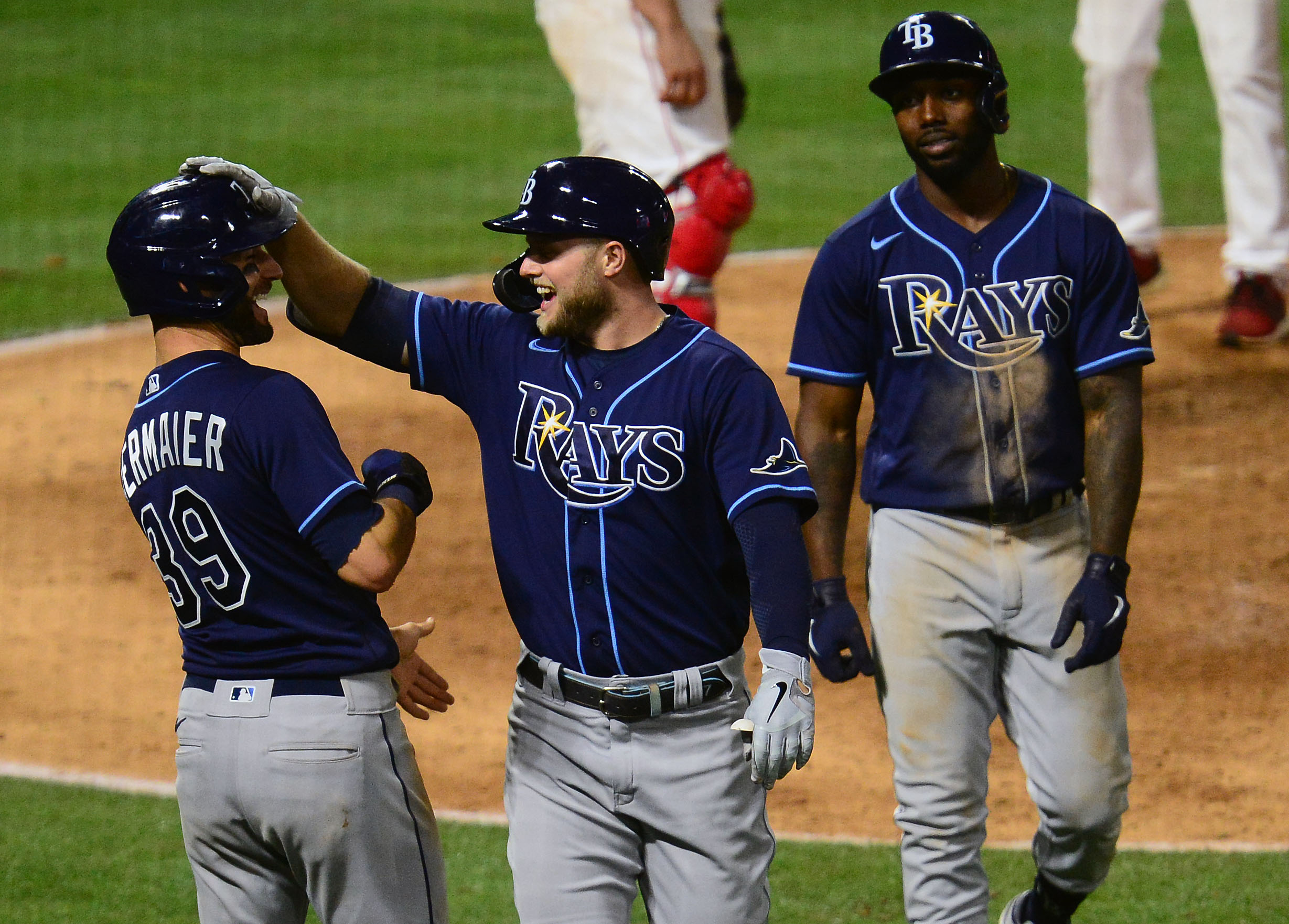 Tampa Bay Rays designated hitter Austin Meadows is greeted by left fielder Randy Arozarena and center fielder Kevin Kiermaier after hitting a three run home run against the Los Angeles Angels during the eighth inning at Angel Stadium.