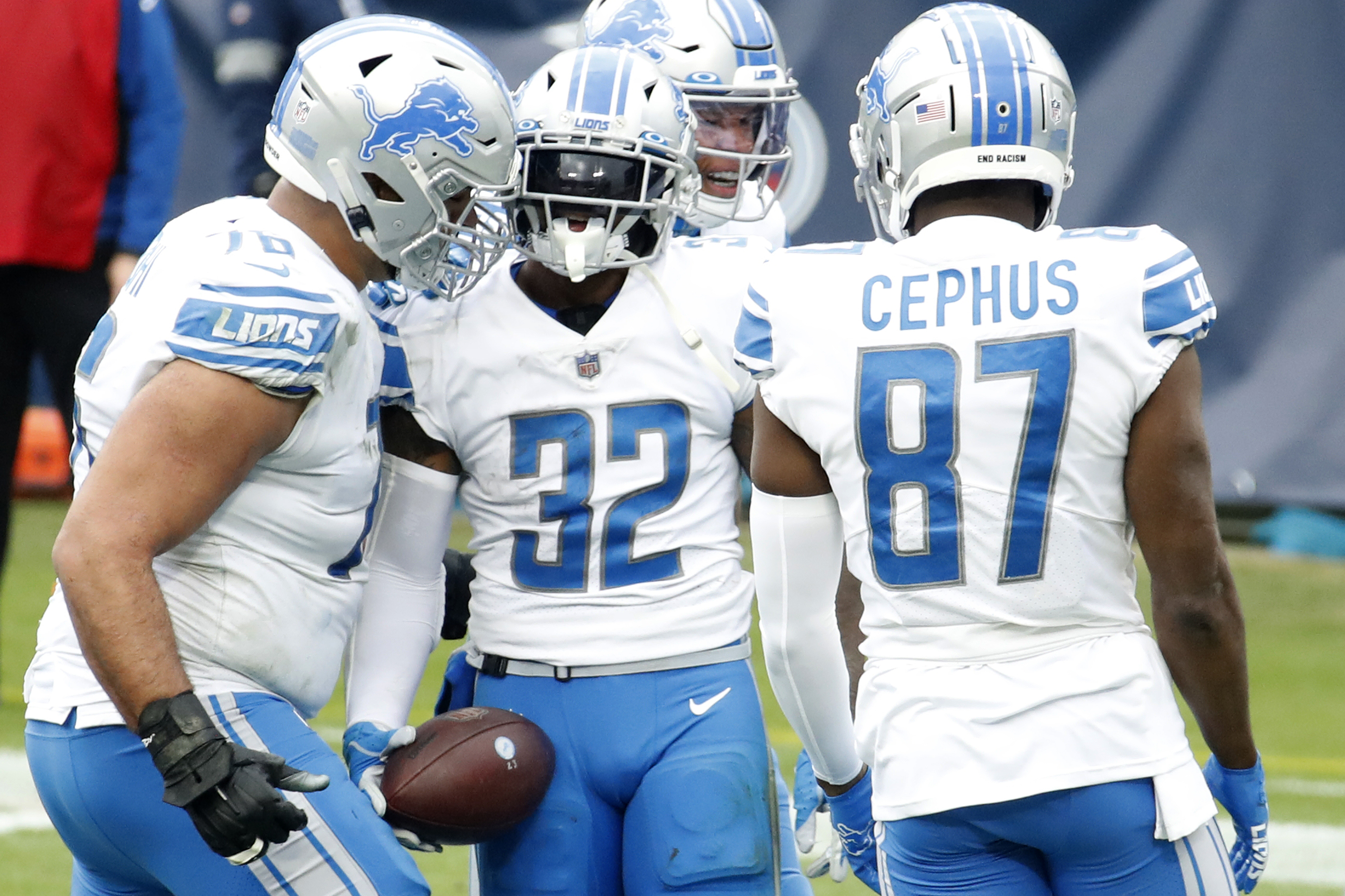 Running back D’Andre Swift #32 of the Detroit Lions celebrates with teammates after rushing for a touchdown over the Tennessee Titans during the second quarter of the game at Nissan Stadium on December 20, 2020 in Nashville, Tennessee.