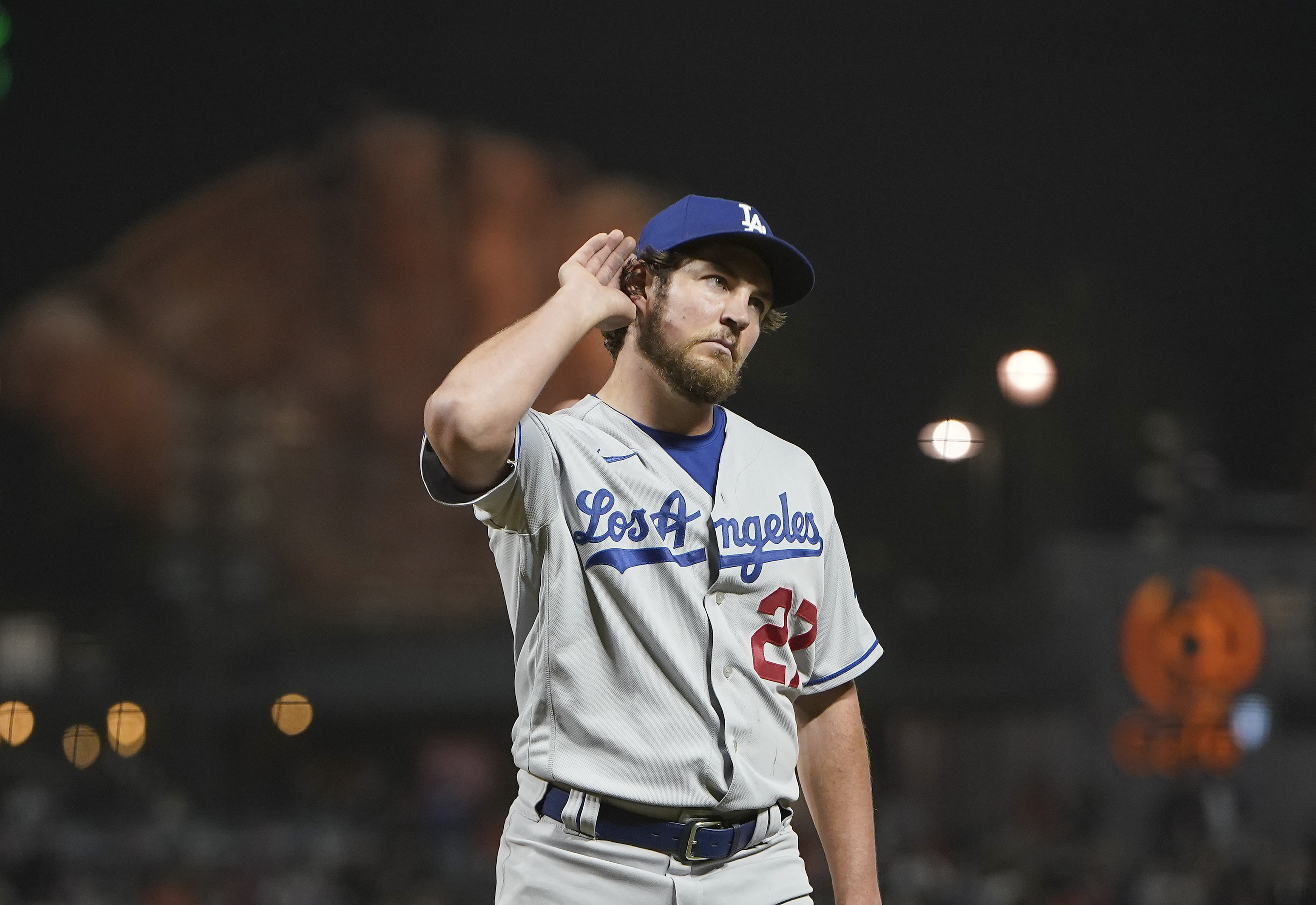 Trevor Bauer of the Los Angeles Dodgers reacts to fans booing him as he leaves the game against the San Francisco Giants in the seventh inning at Oracle Park on May 21, 2021 in San Francisco, California.