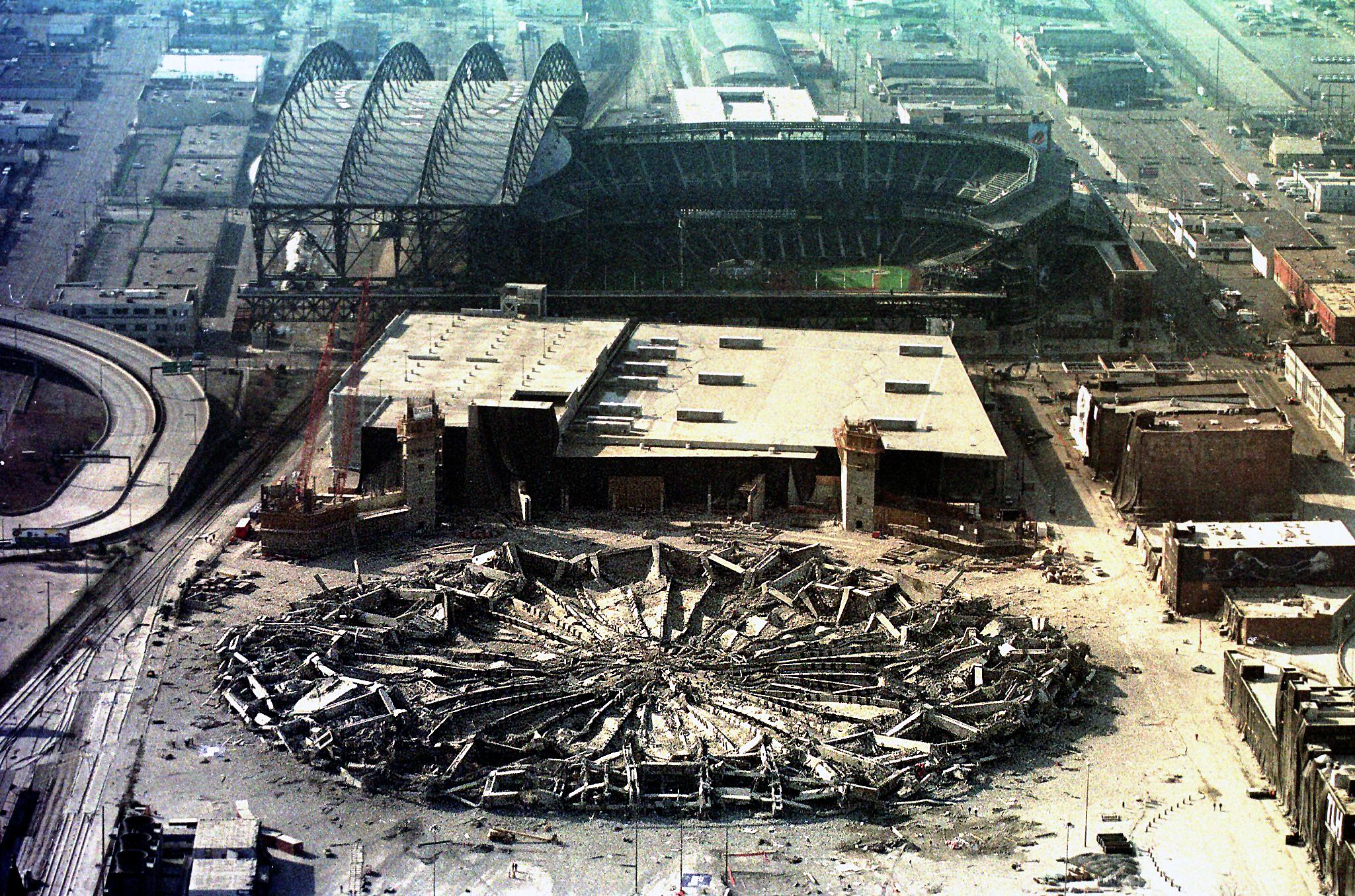 The Seattle Kingdome lies flattened by the force o