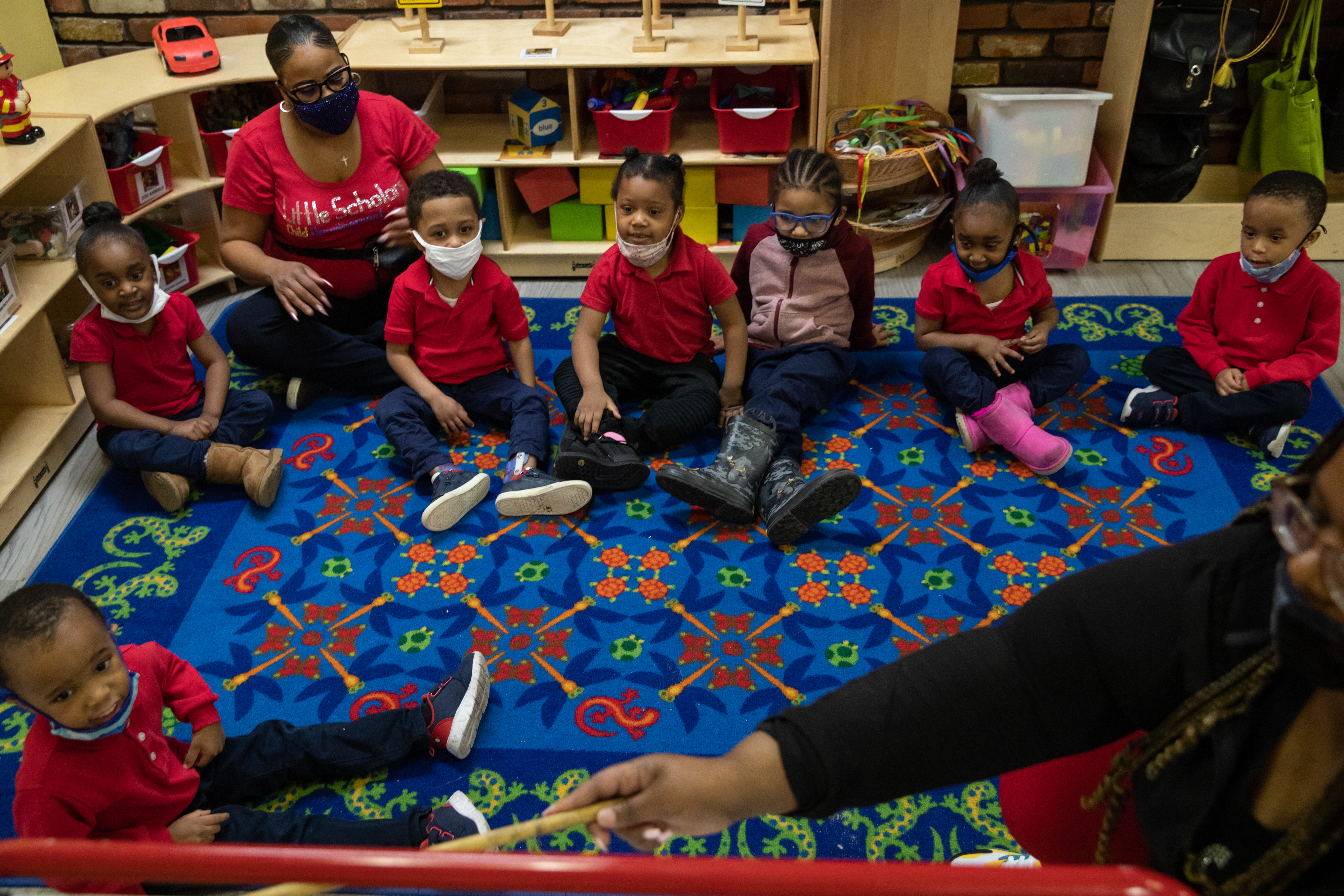 Preschoolers participate in morning exercises at Little Scholars child care center.