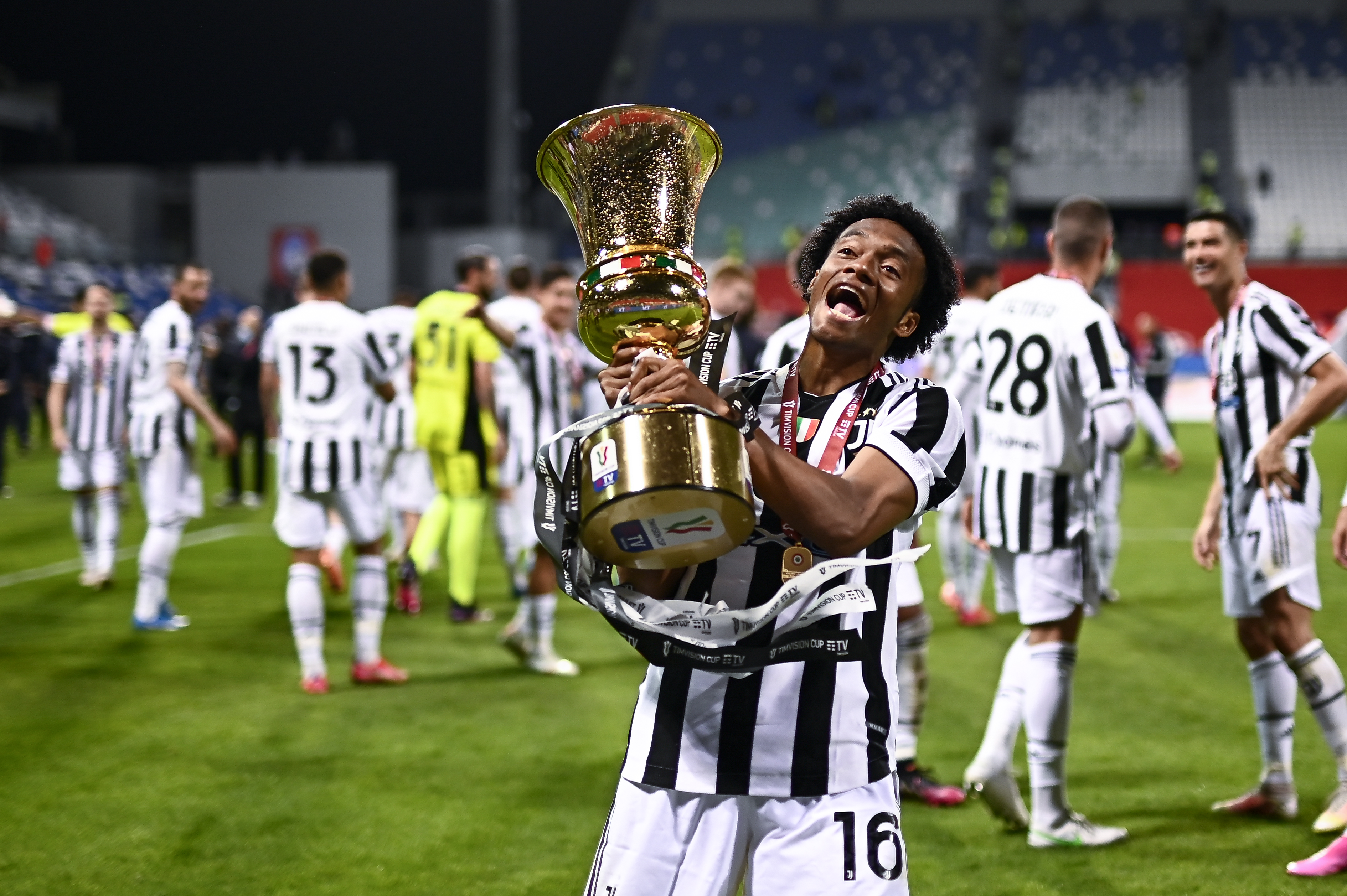 Juan Cuadrado of Juventus FC celebrates with hte trophy...