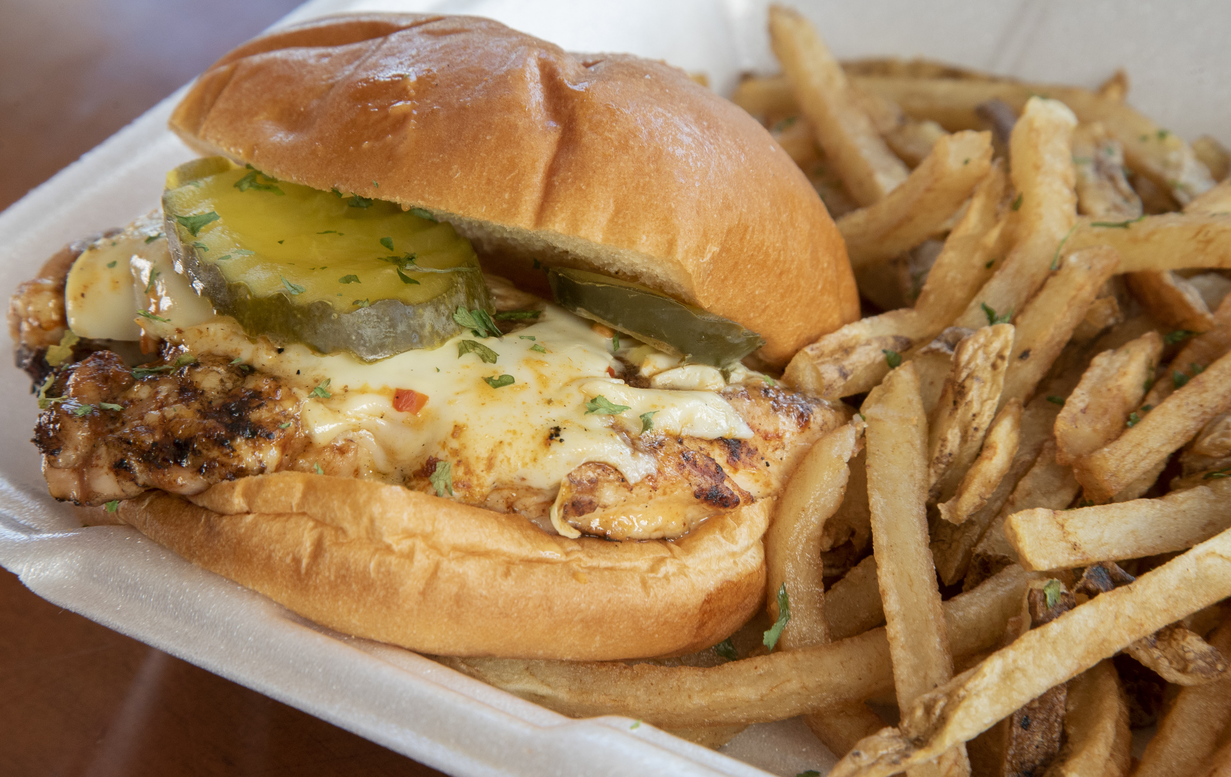 The grilled chicken sandwich is served at BaseHit BBQ &amp; Catering.