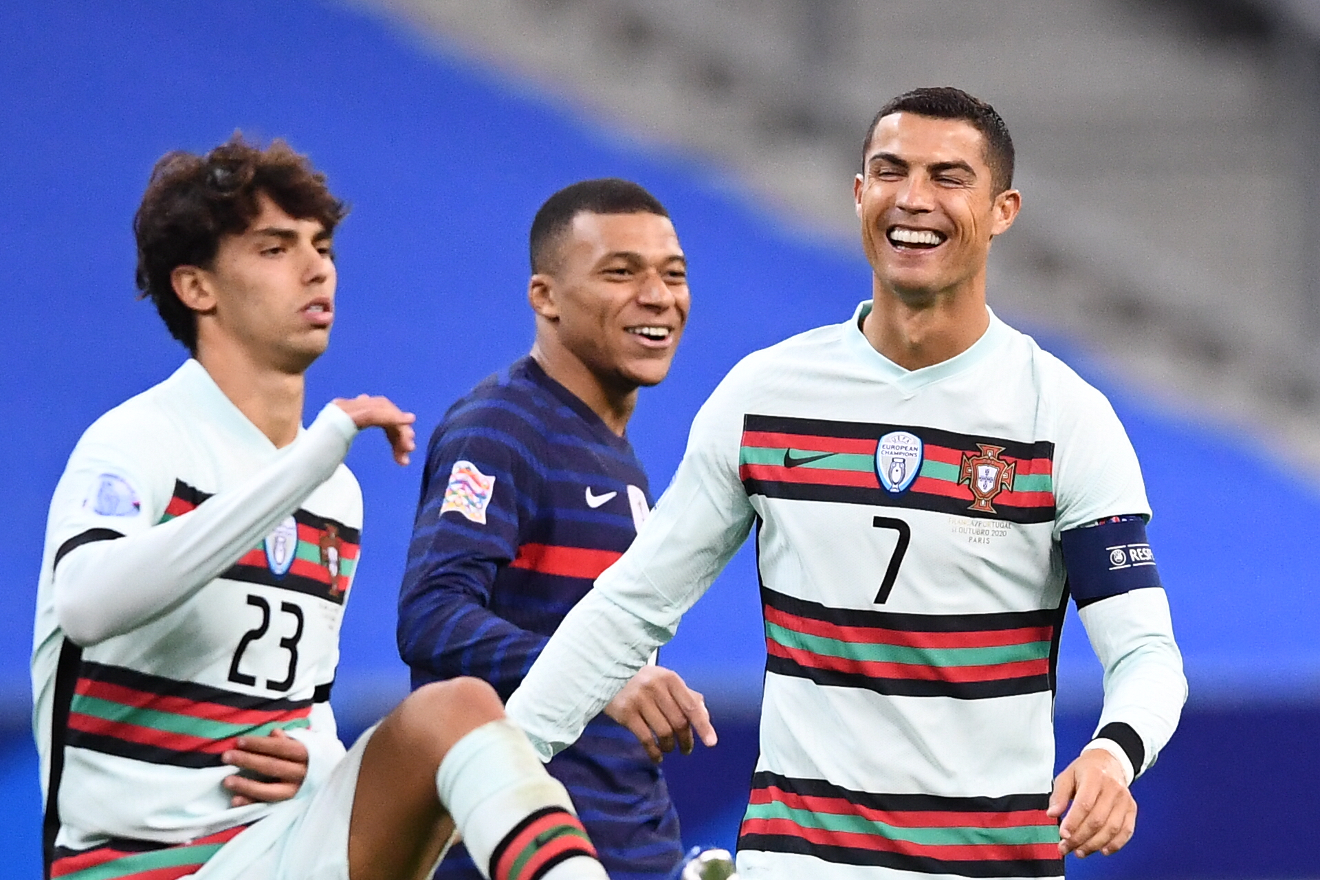 Kylian Mbappe shares a laugh with Portugal’s forward Cristiano Ronaldo - France vs Portugal - Euro 2020