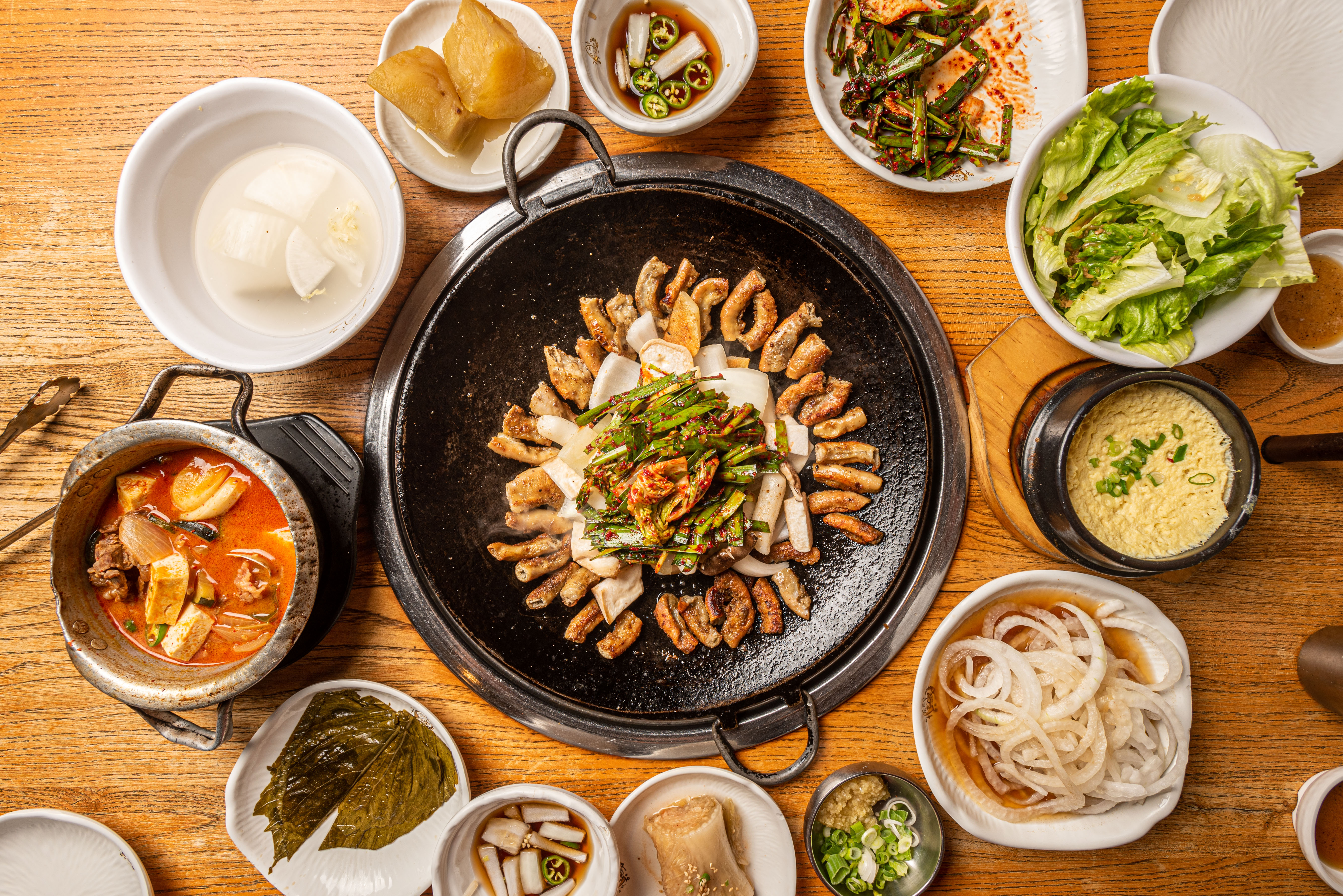 Offal surrounded by various banchan