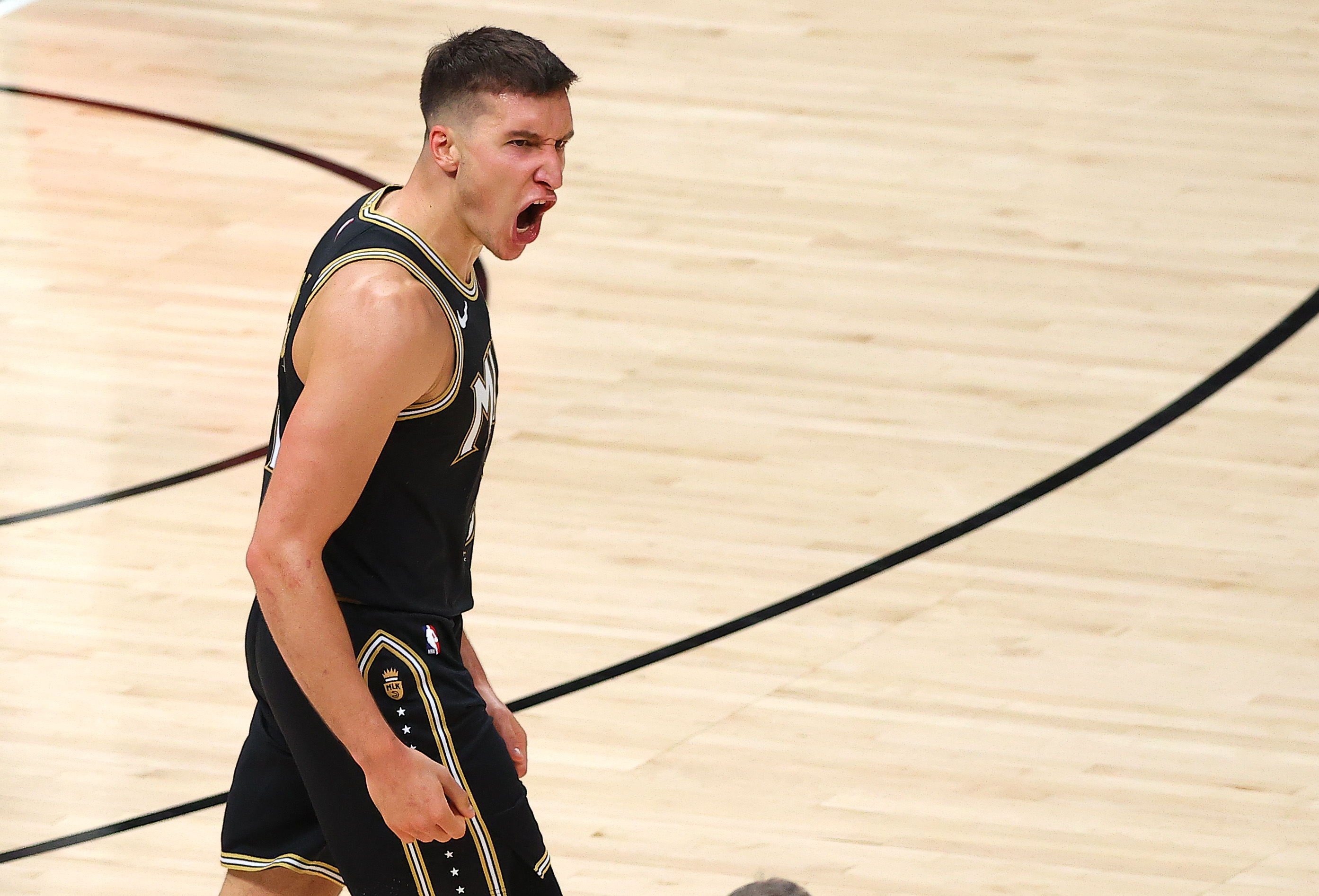 Bogdan Bogdanovic of the Atlanta Hawks celebrates a three point basket against the Milwaukee Bucks during the second half in Game Four of the Eastern Conference Finals at State Farm Arena on June 29, 2021 in Atlanta, Georgia.&nbsp;
