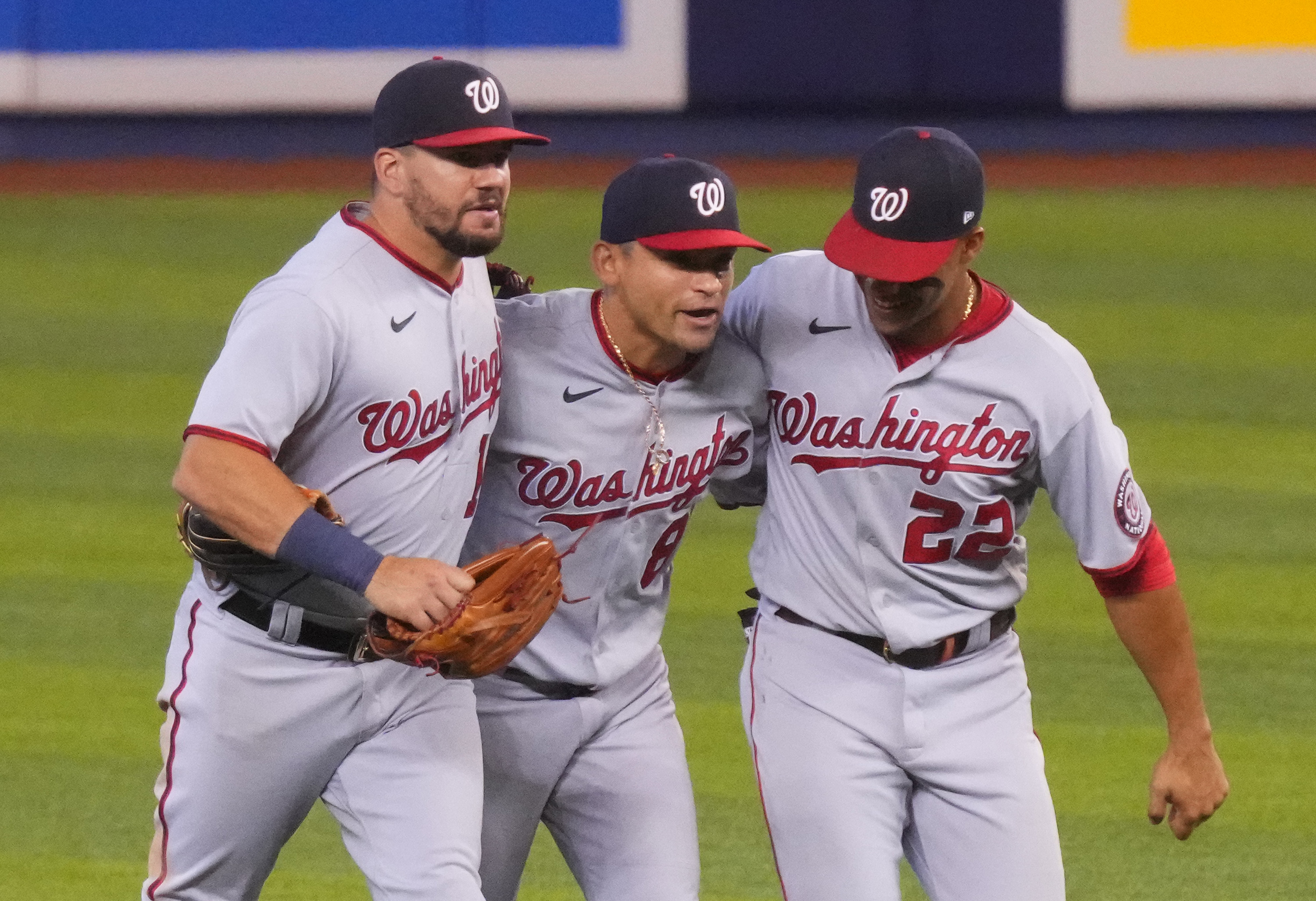 Kyle Schwarber #12, Gerardo Parra #88, and Juan Soto #22 of the Washington Nationals celebrate the win against the Miami Marlins by score of 5-1 at loanDepot park