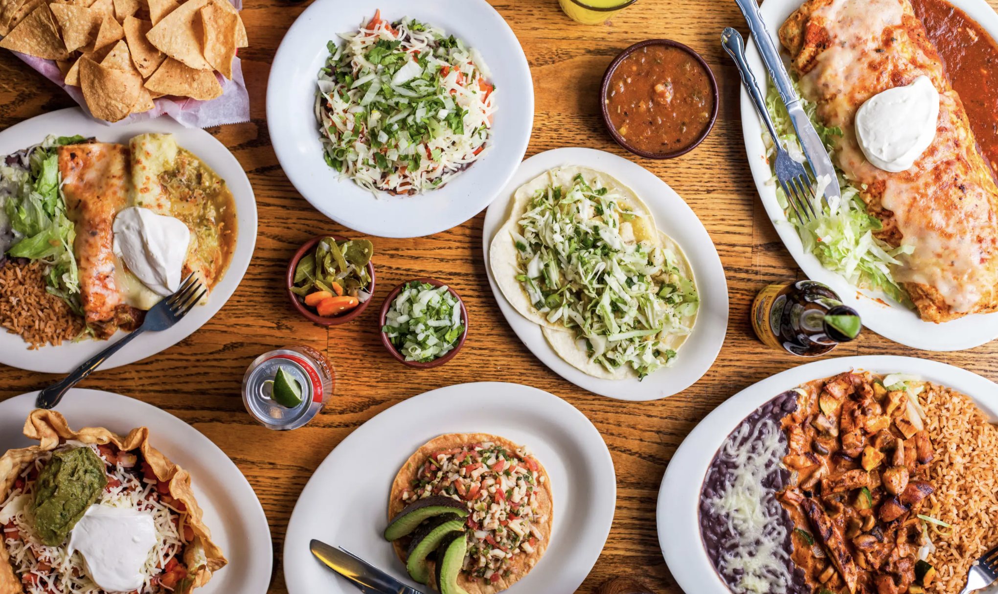 A selection of burritos, tacos, and other Mexican plates at Gorditos in Seattle, top-down view