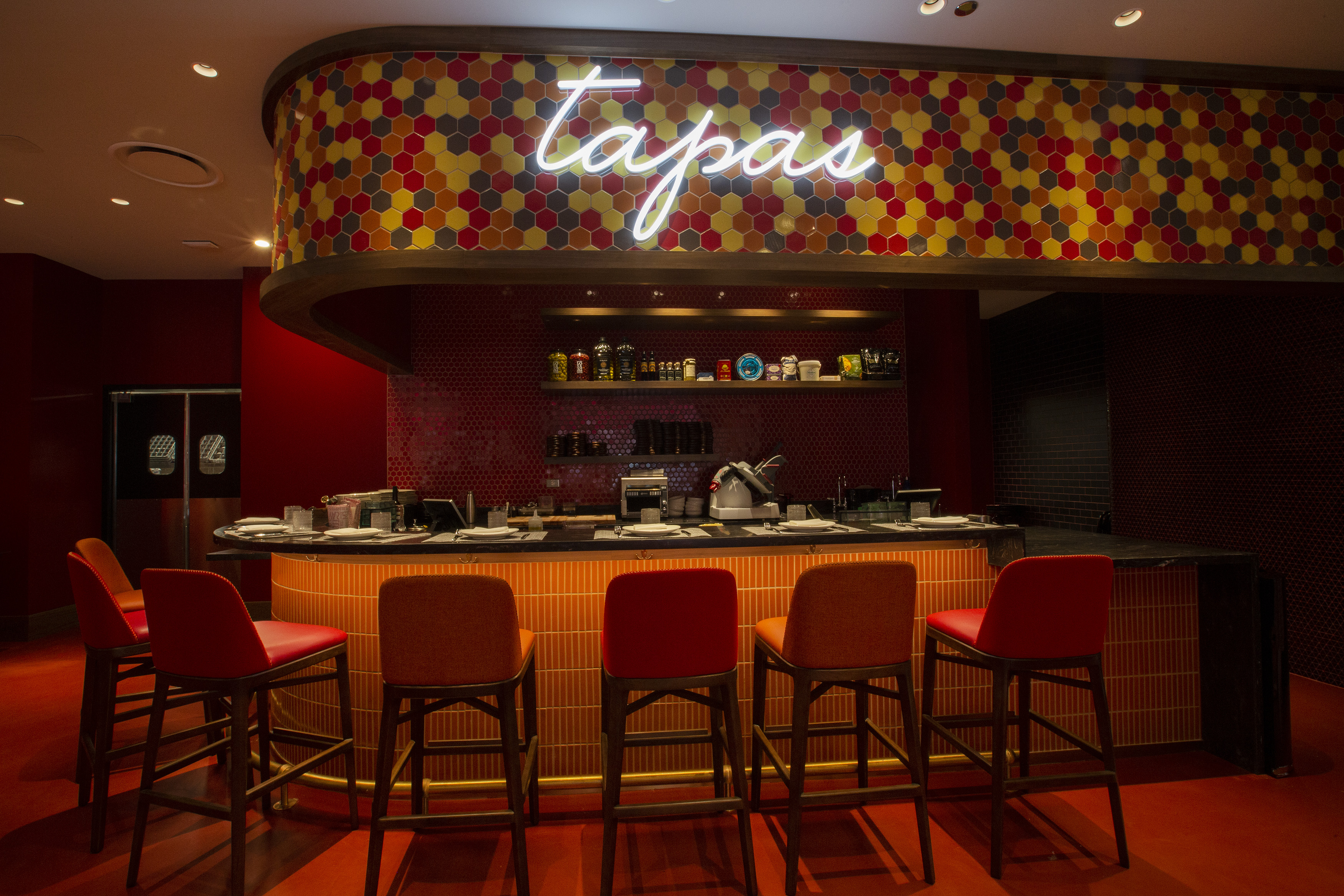 A tapas bar with neon signs.