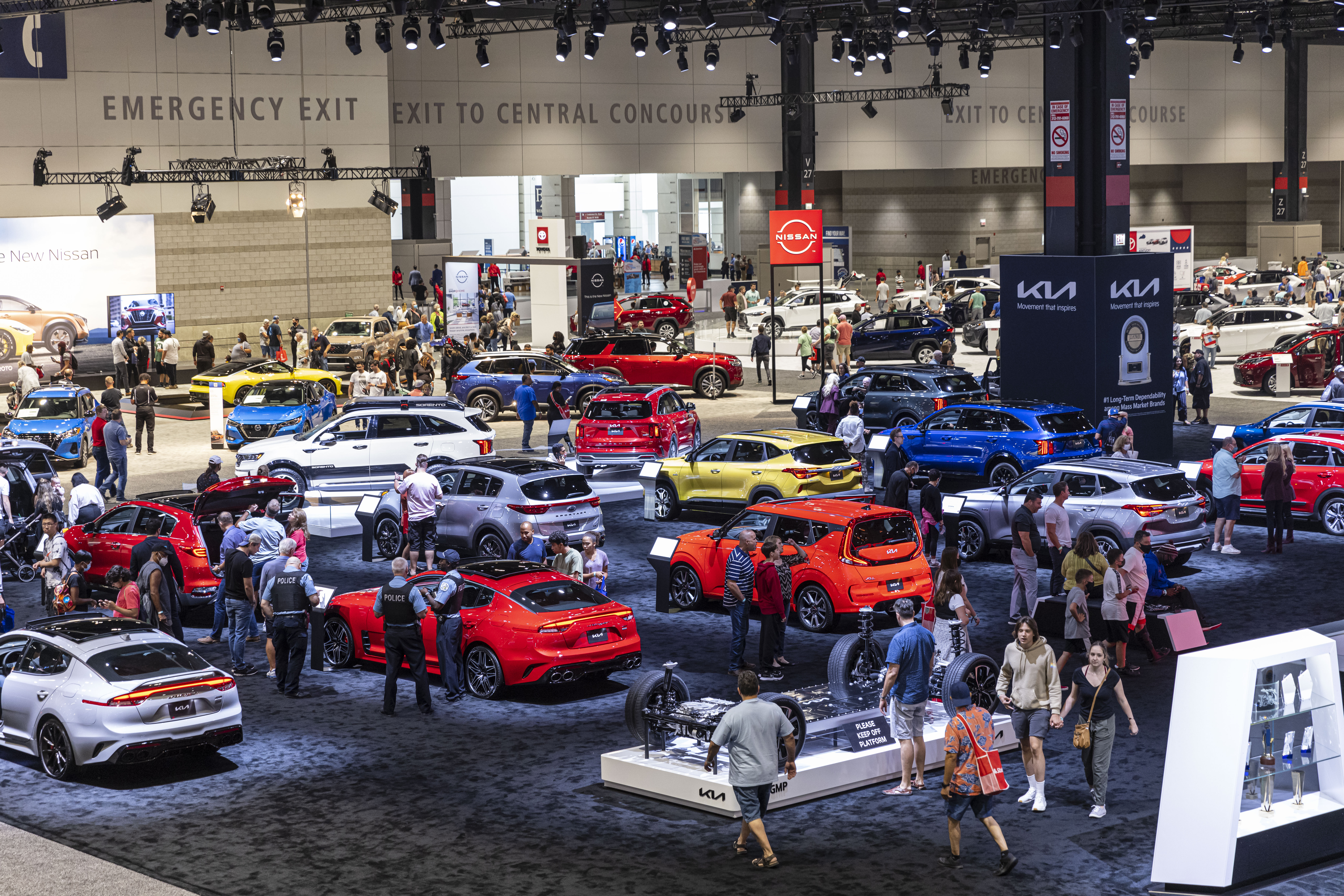 Crowds of people walk the floor checking out different vehicles at the Chicago Auto Show at the McCormick Place West Building in South Loop, Thursday, July 15, 2021.