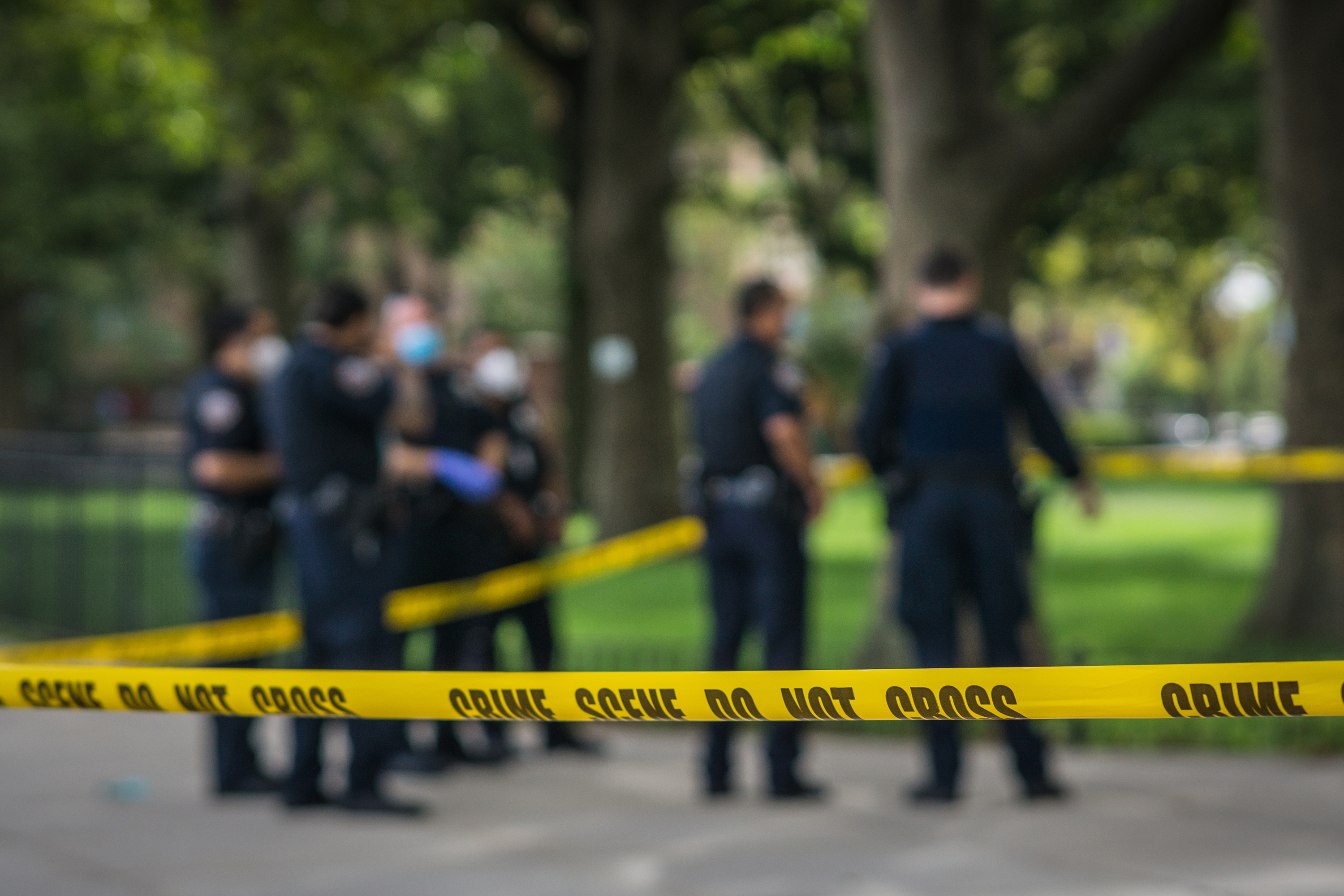 Crime scene tape surrounds police investigating a shooting in The Bronx, Sept. 13, 2020.