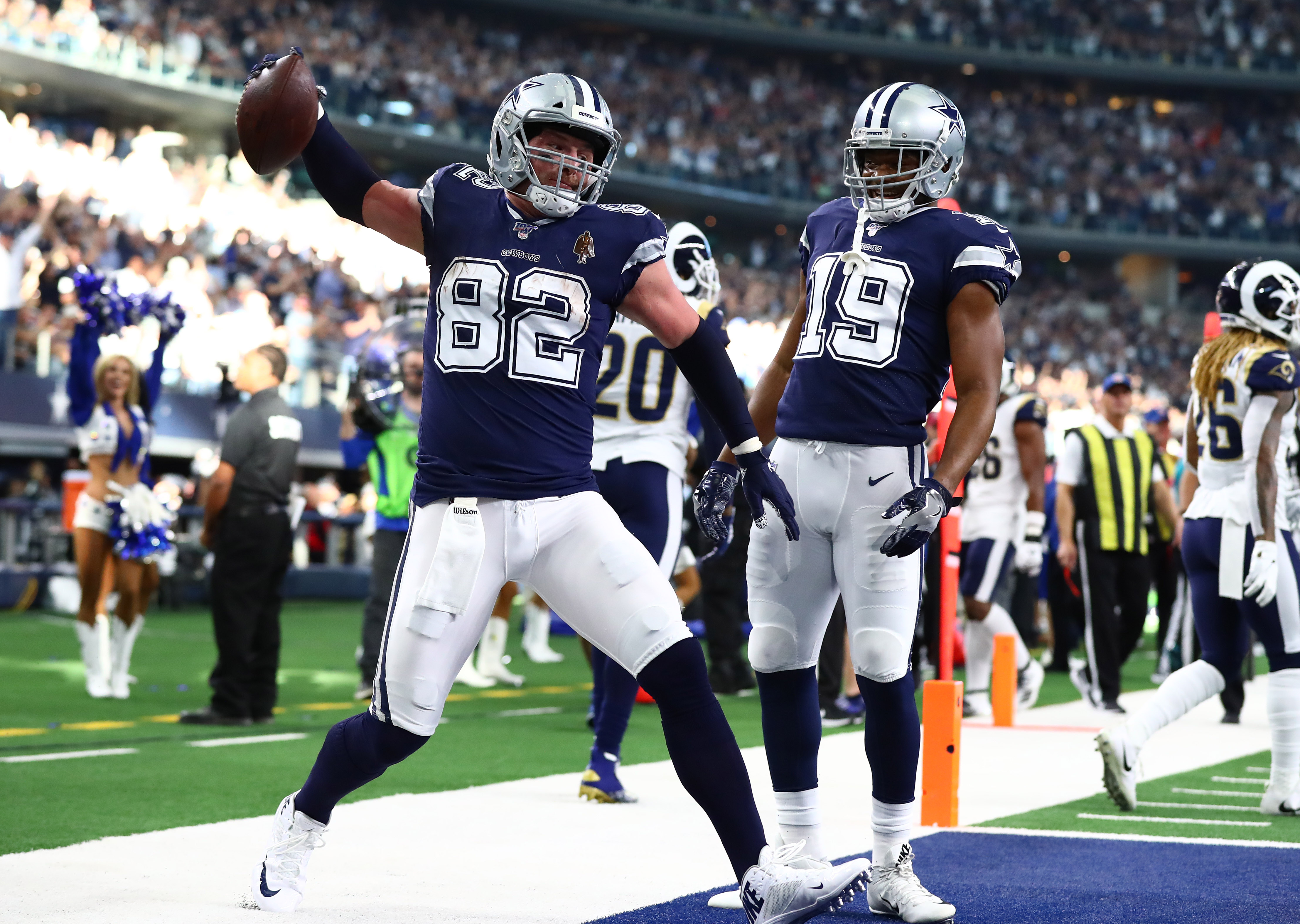 Dallas Cowboys tight end Jason Witten (82) spikes to ball while celebrating his first quarter touchdown with receiver Amari Cooper (19) against the Los Angeles Rams at AT&amp;amp;T Stadium.