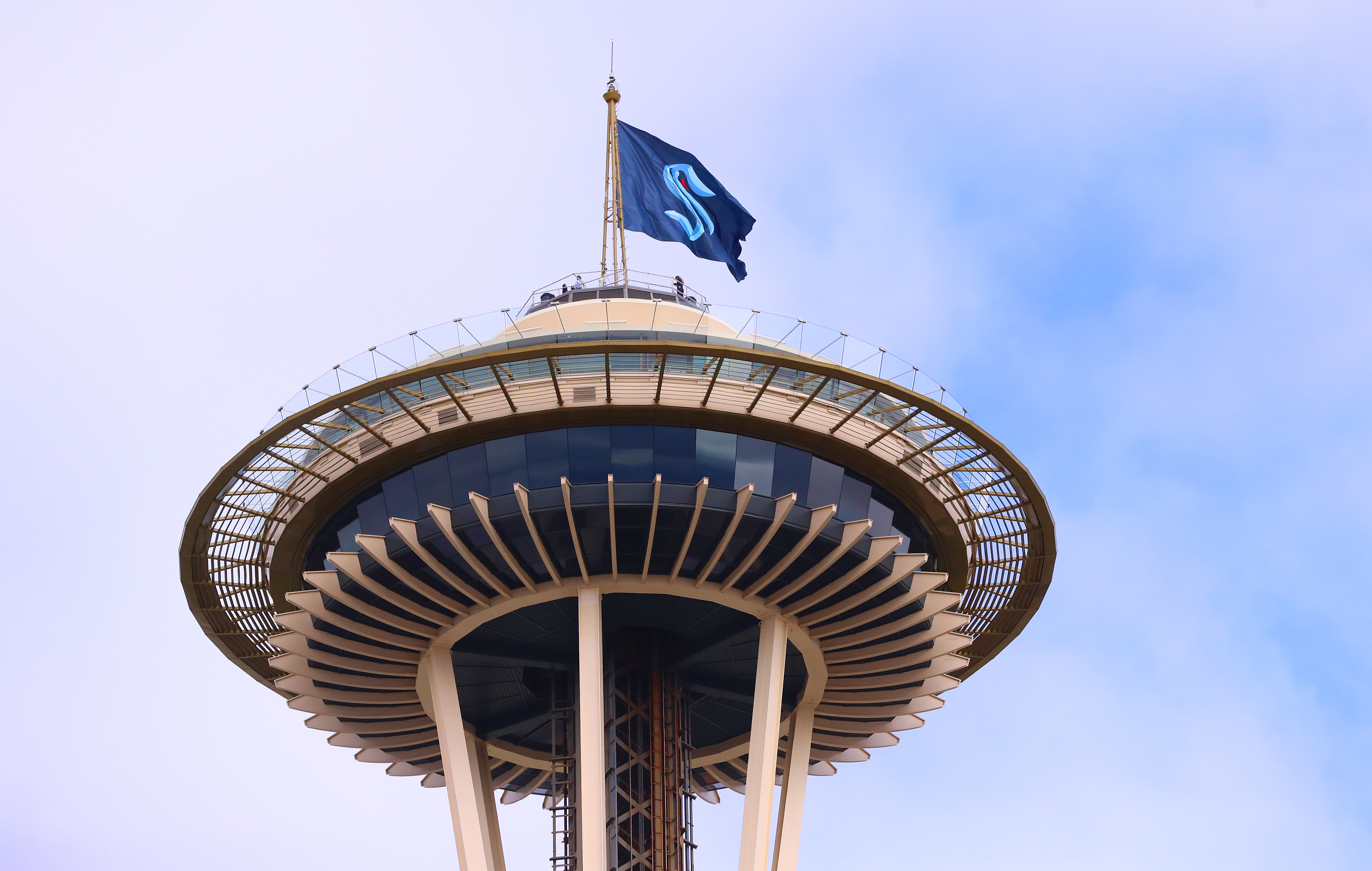 A general view of the Space Needle as the Seattle Kraken team flag is hung from above on July 23, 2020 in Seattle, Washington.