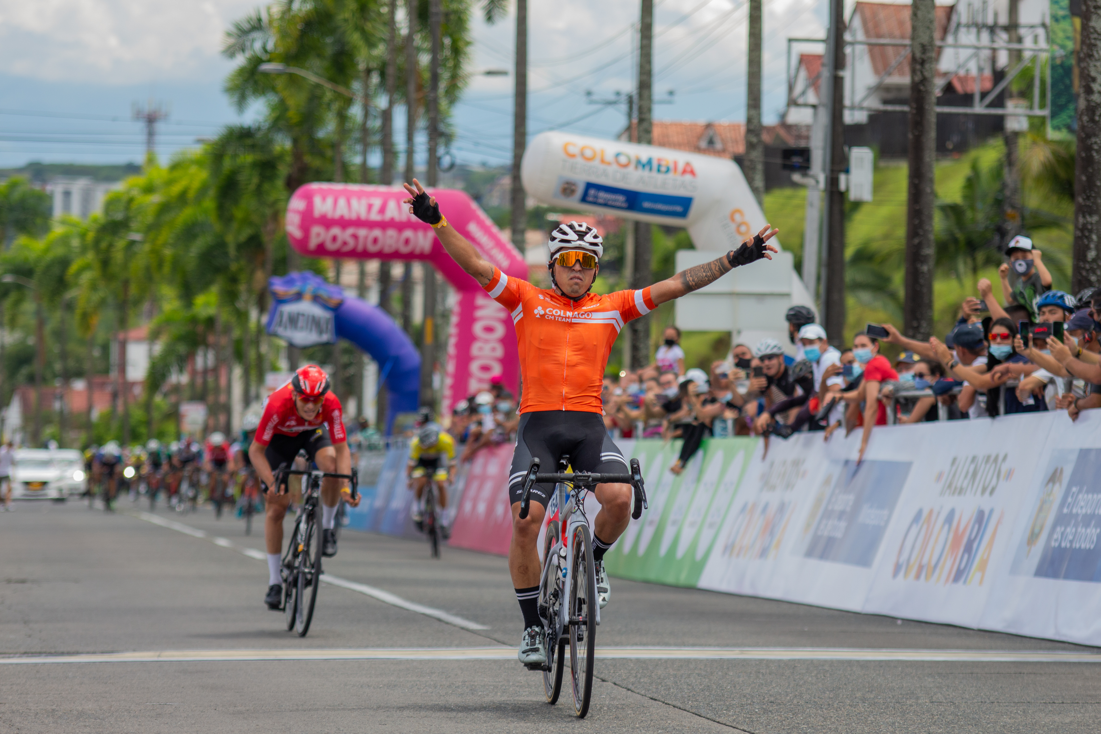 Cyclists Juan Esteban Guerrero of Colnago CM Team celebrating victory during the SUB-23 Qualifiers Colombian National Road Race Bicycle Championship in Pereira, Colombia on June 19, 2021.