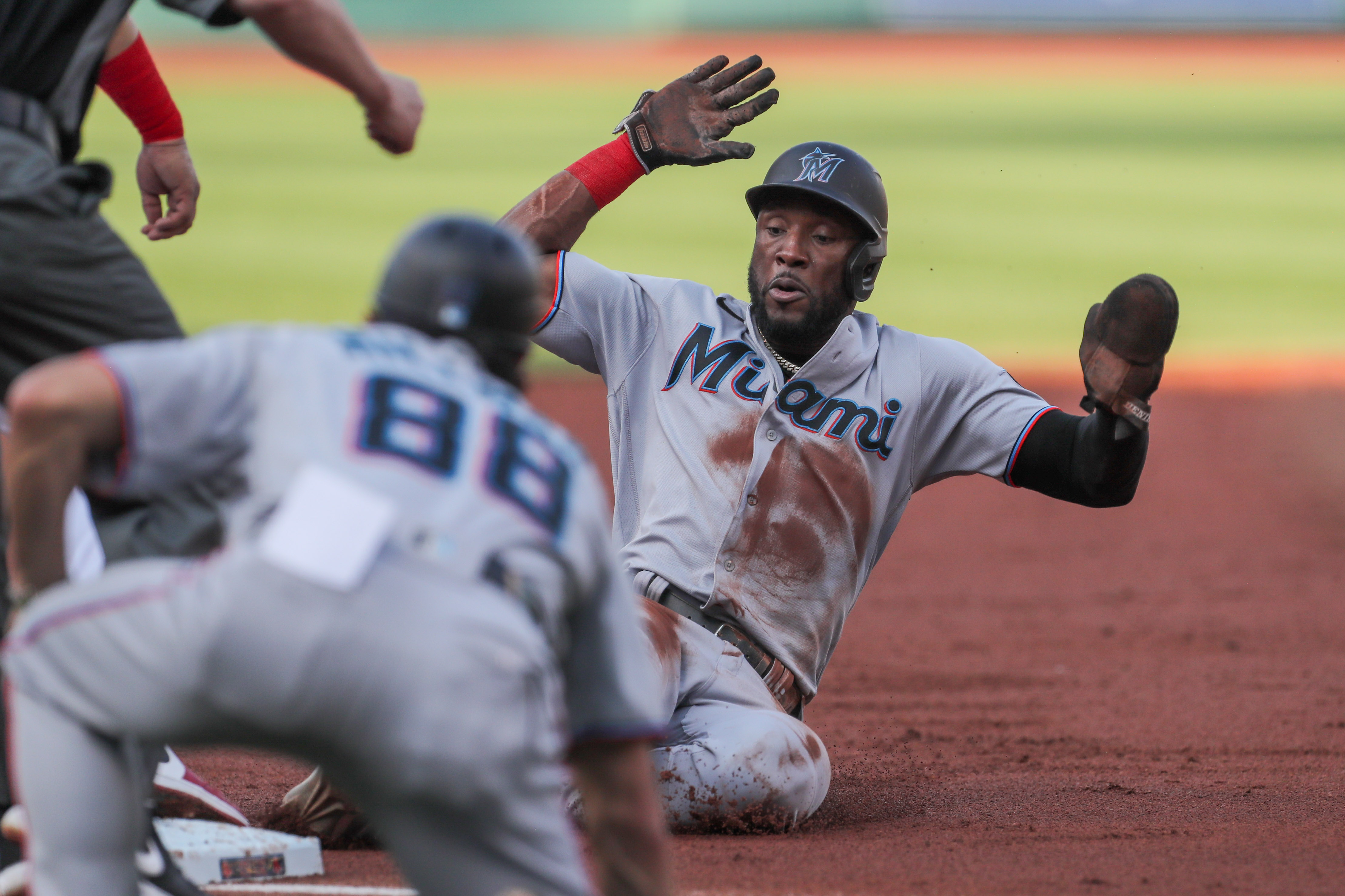Miami Marlins center fielder Starling Marte (6) slides into third during the third inning against the Boston Red Sox at Fenway Park