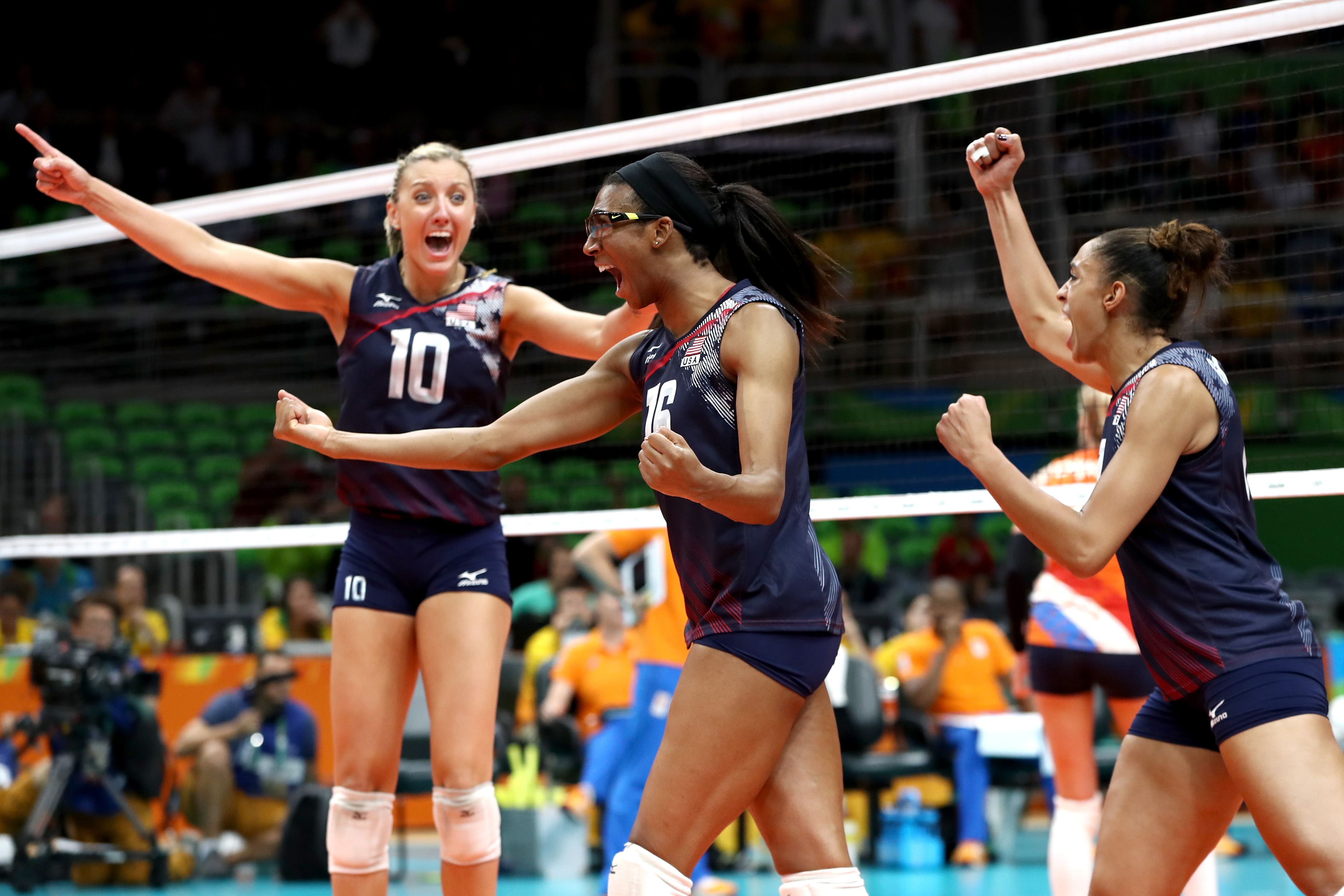 Jordan Larson-Burbach, Foluke Akinradewo and Alisha Glass of United States celebrate winning match point during the Women’s Bronze Medal Match between Netherlands and the United States on Day 15 of the Rio 2016 Olympic Games at the Maracanazinho on August 20, 2016 in Rio de Janeiro, Brazil.