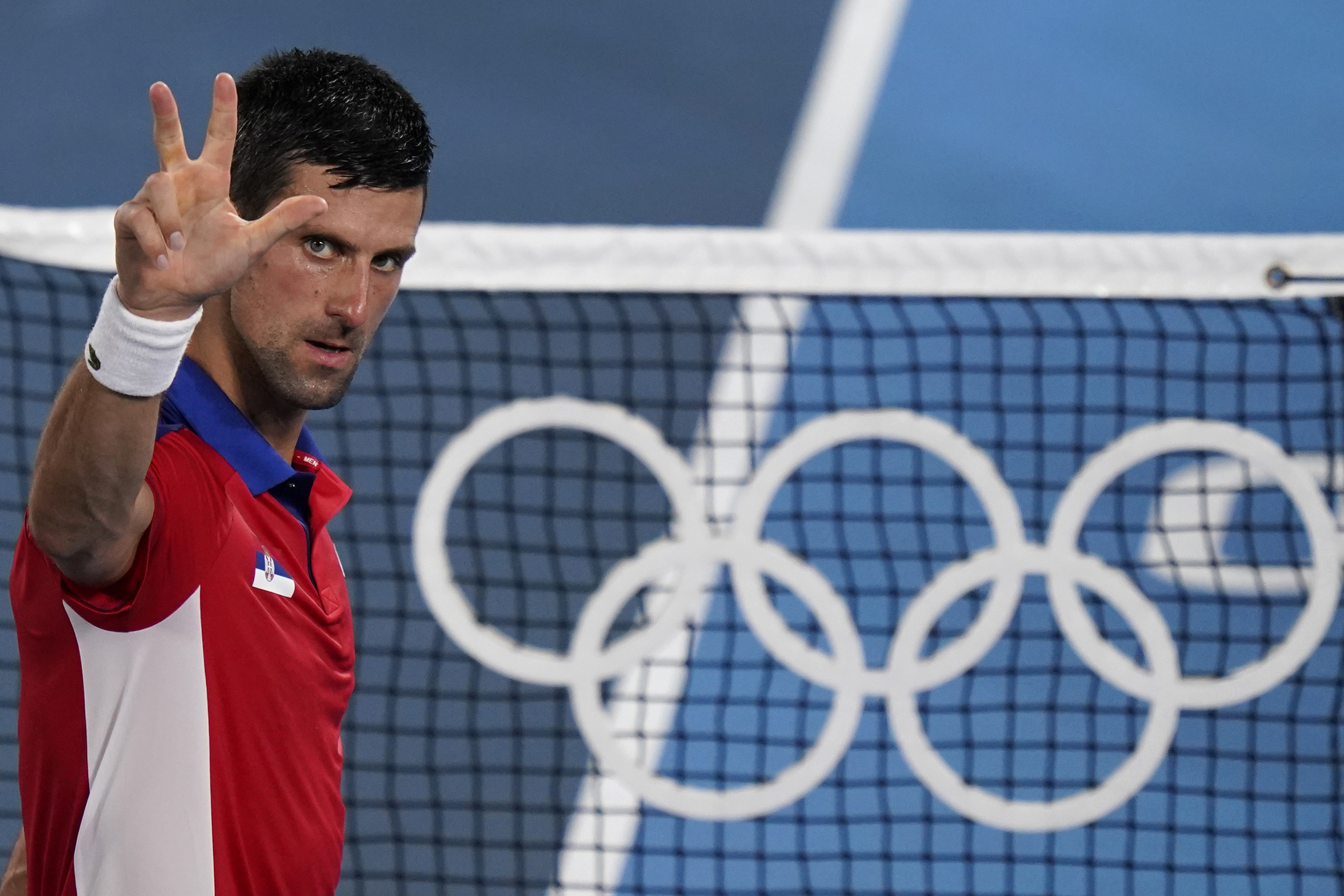 Novak Djokovic, of Serbia, celebrates after defeating Kei Nishikori, of Japan, during the quarterfinals of the tennis competition at the Tokyo Olympics.