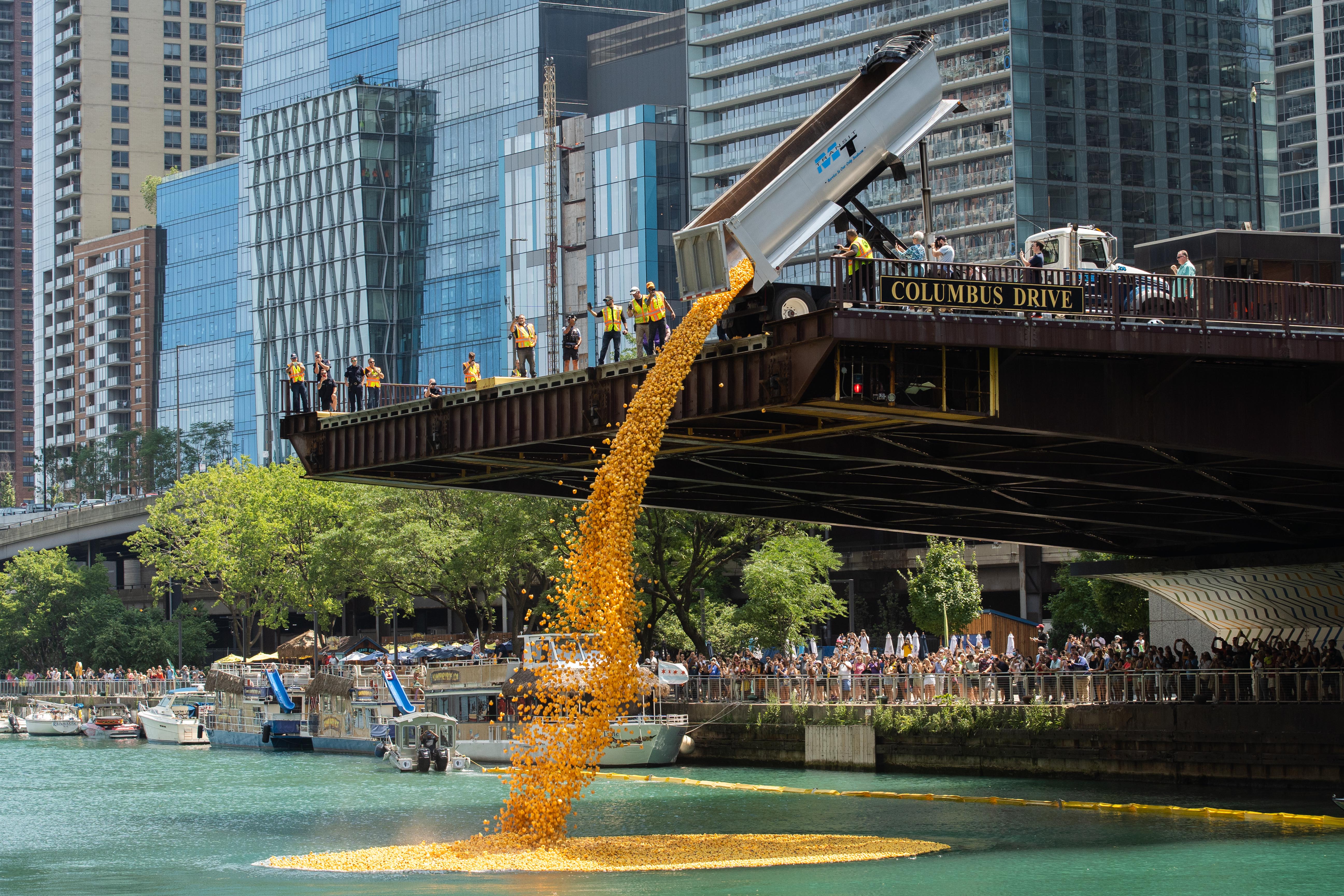 70,000 rubber ducks are thrown into the Chicago River near the Columbus Bridge in the Loop during the Chicago Ducky Derby, Thursday afternoon, Aug. 5, 2021. The Chicago Ducky Derby was held to raise funds for Special Olympics Illinois. 