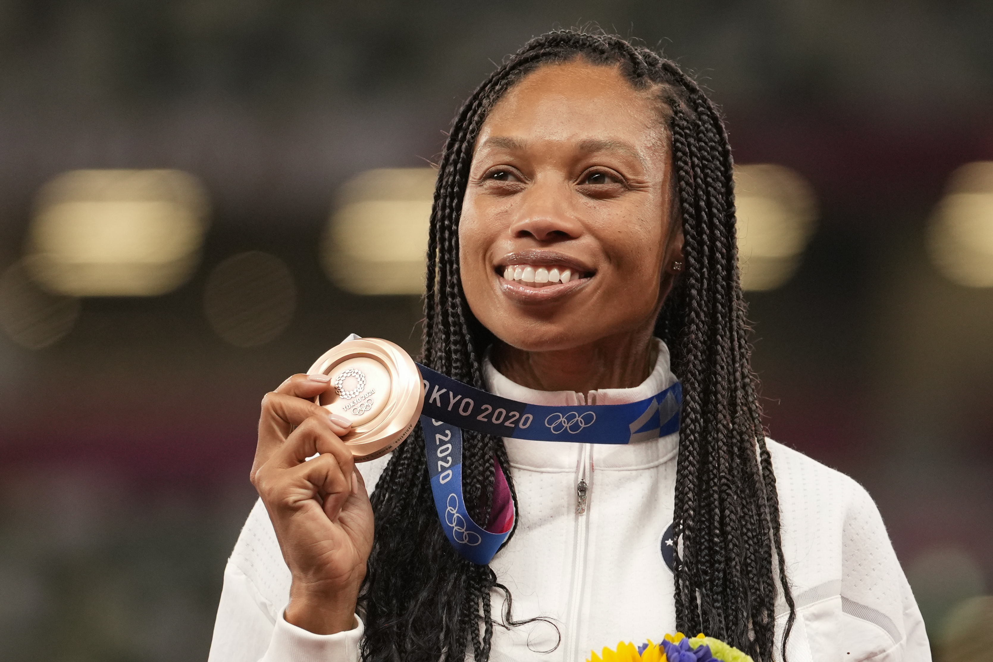 Bronze medalist Allyson Felix, of the United States, poses during the medal ceremony for the women’s 400-meter run.