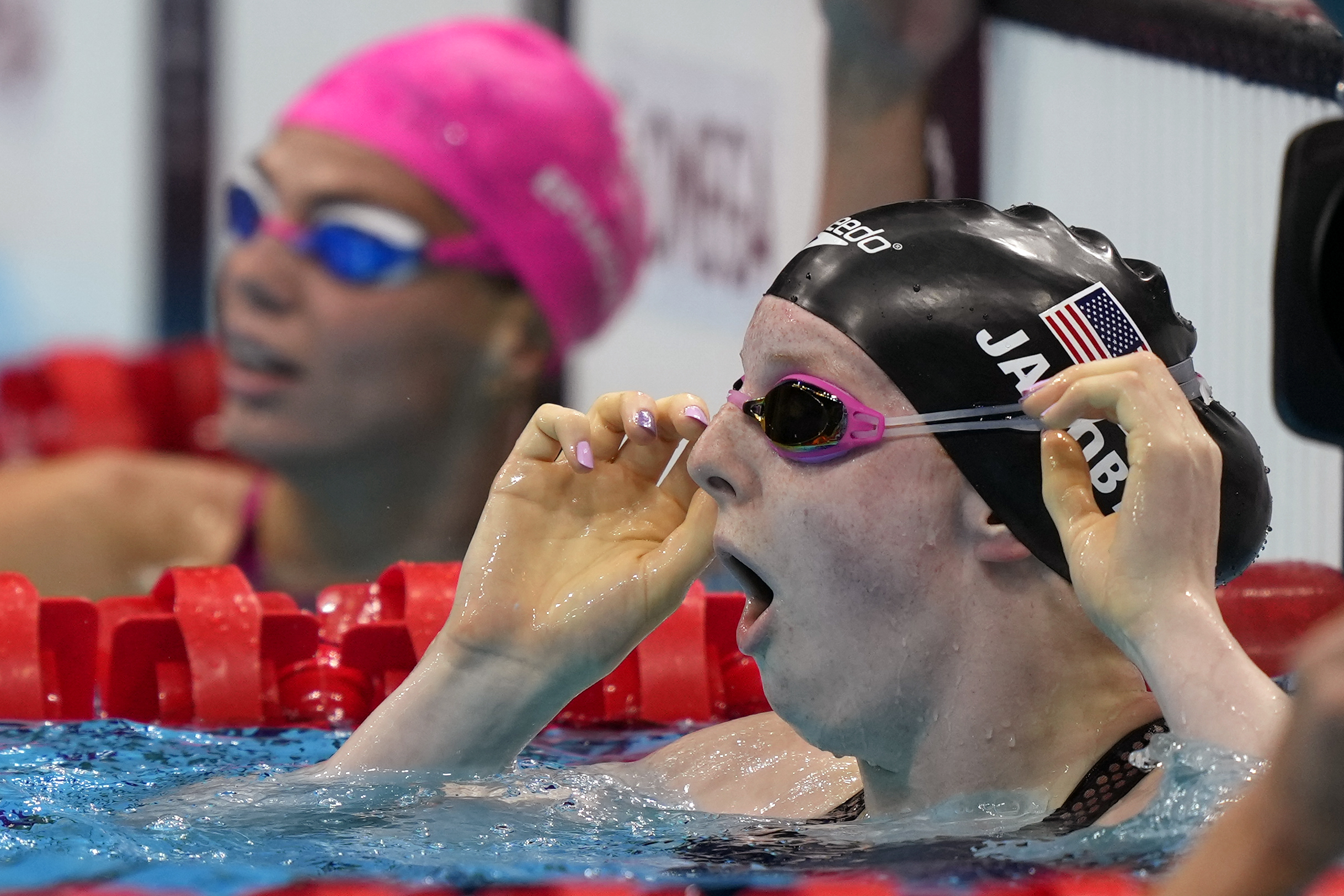 Lydia Jacoby of the United States reacting at seeing the results after winning the final of the women’s 100-meter breaststroke at the 2020 Summer Olympics in Tokyo.