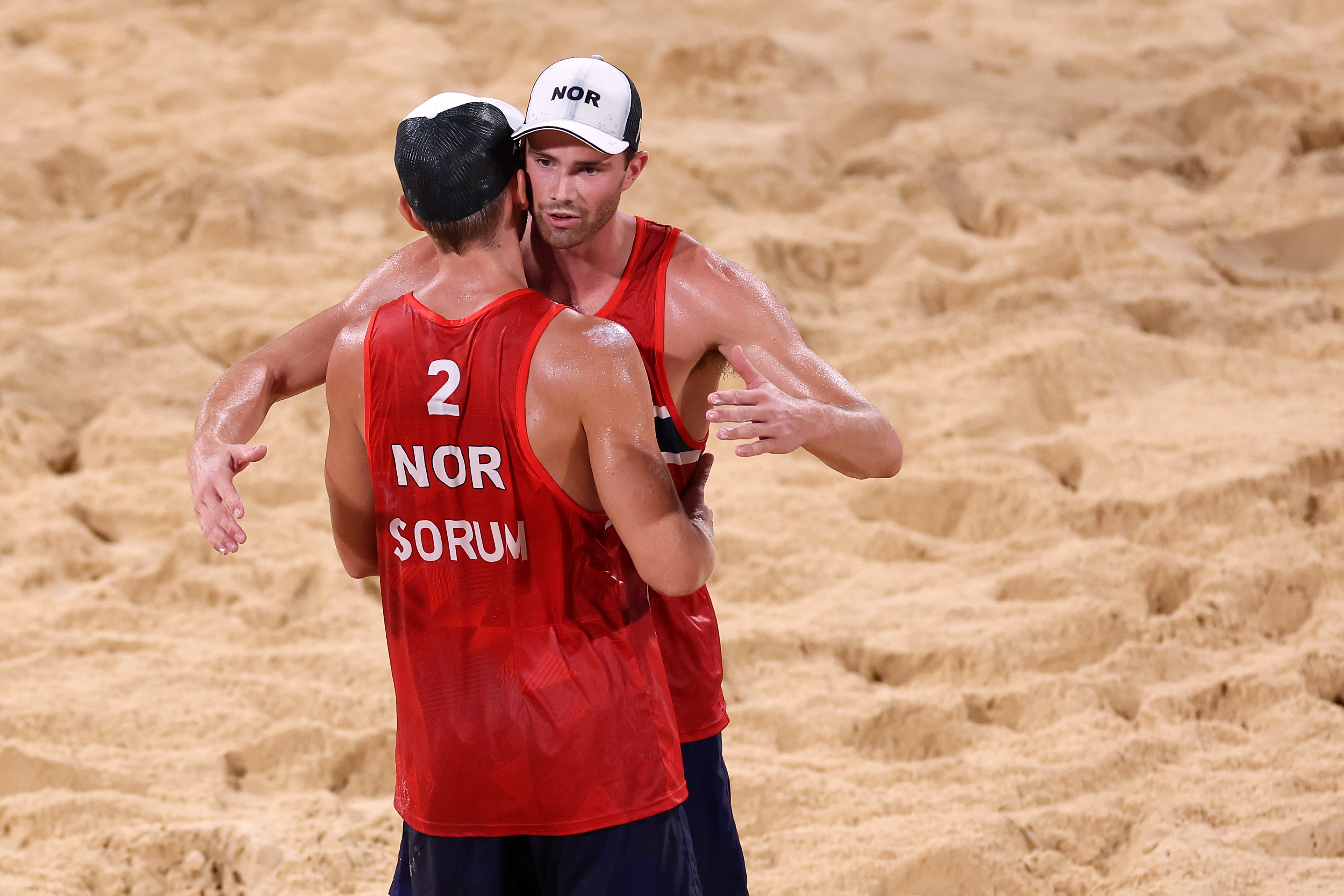 Anders Berntsen Mol and Christian Sandlie Sorum of Team Norway react after they defeated Team Latvia during Men’s Semifinal beach volleyball on day thirteen of the Tokyo 2020 Olympic Games at Shiokaze Park on August 05, 2021 in Tokyo, Japan.