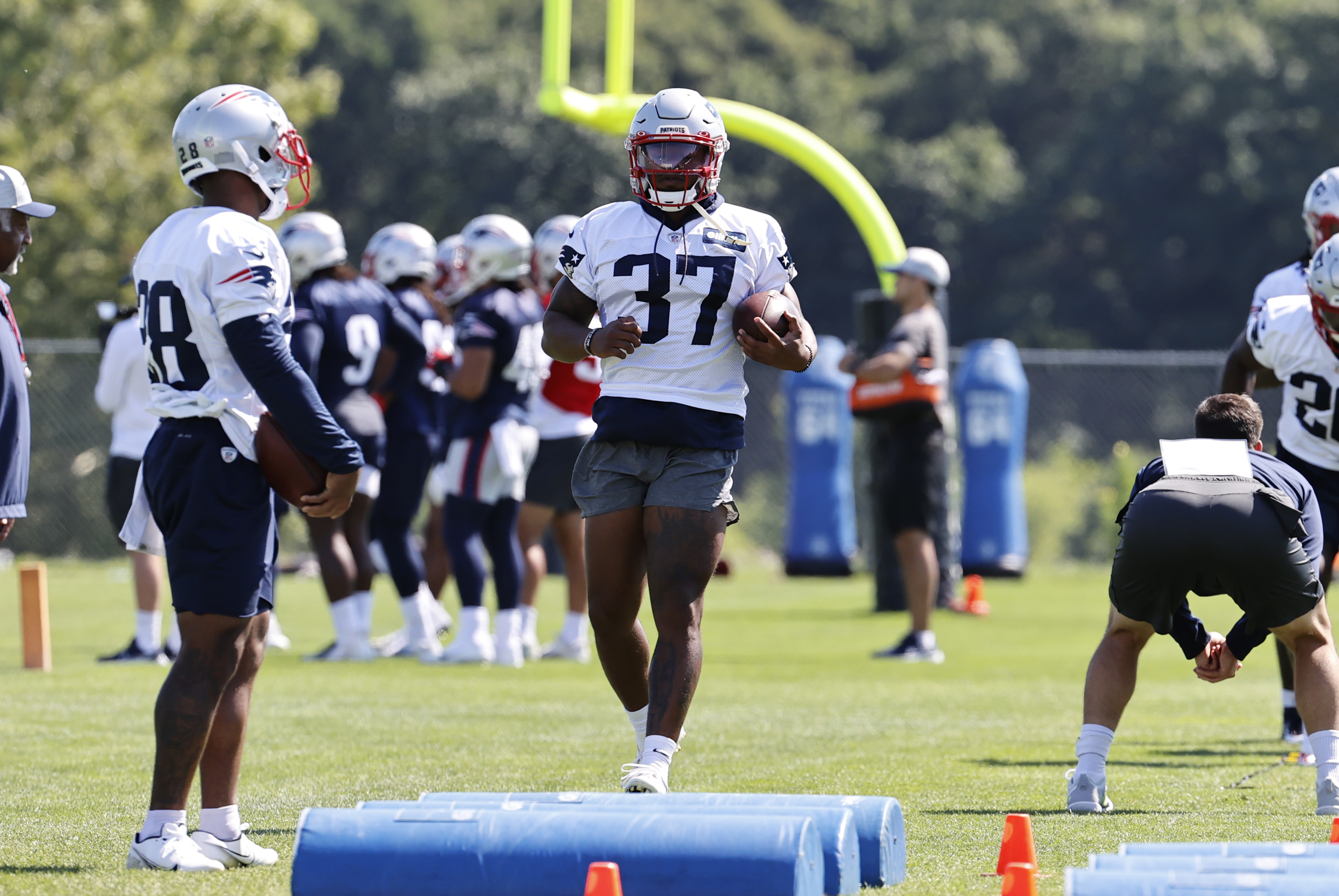 New England Patriots running back Damien Harris (37) runs a drill during New England Patriots training camp on July 31, 2021 at Gillette Stadium in Foxborough, Massachusetts.