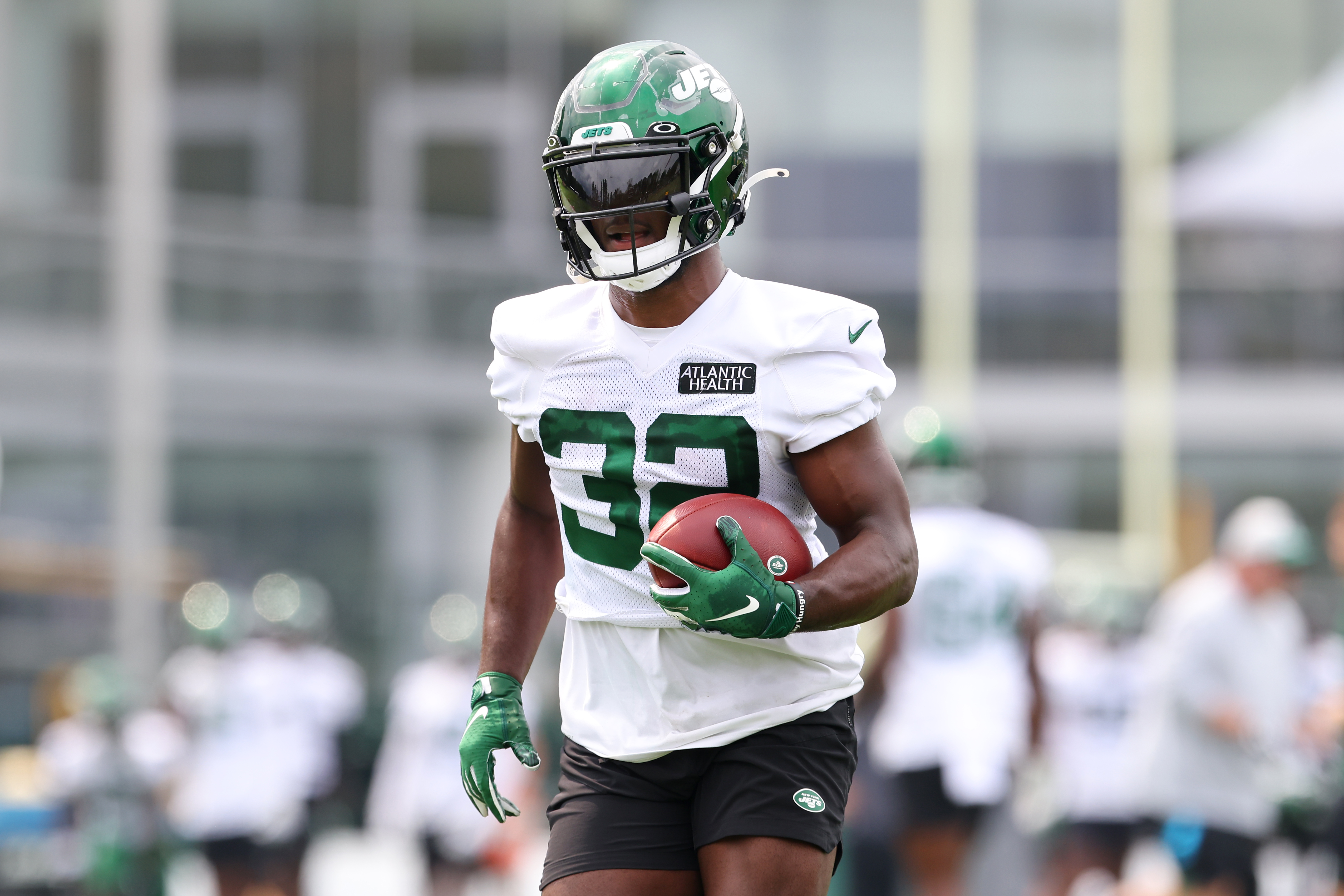 Michael Carter #32 of the New York Jets works out during a morning practice at Atlantic Health Jets Training Center on July 29, 2021 in Florham Park, New Jersey.
