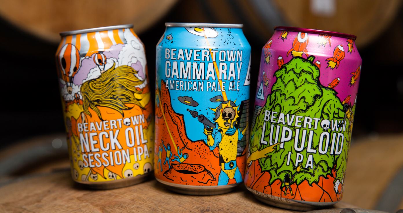 Three cans of Beavertown’s signature beers — Neck Oil, Gamma Ray, and Lupuloid