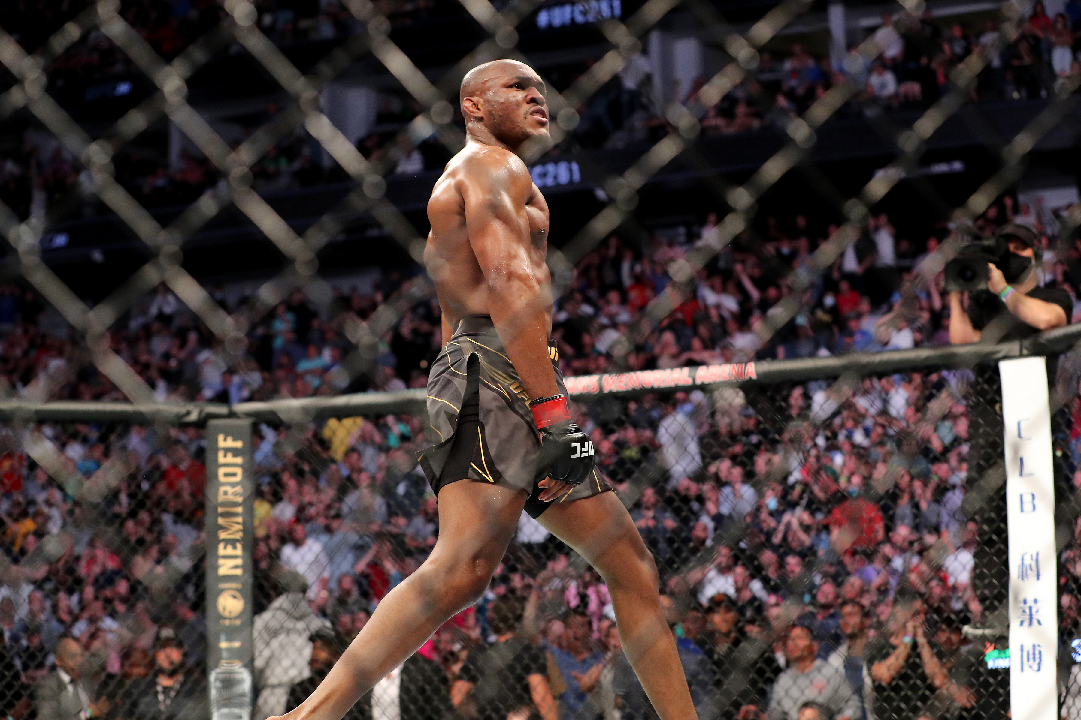 Kamaru Usman walks away in triumph after his KO of Jorge Masvidal at UFC 261. 