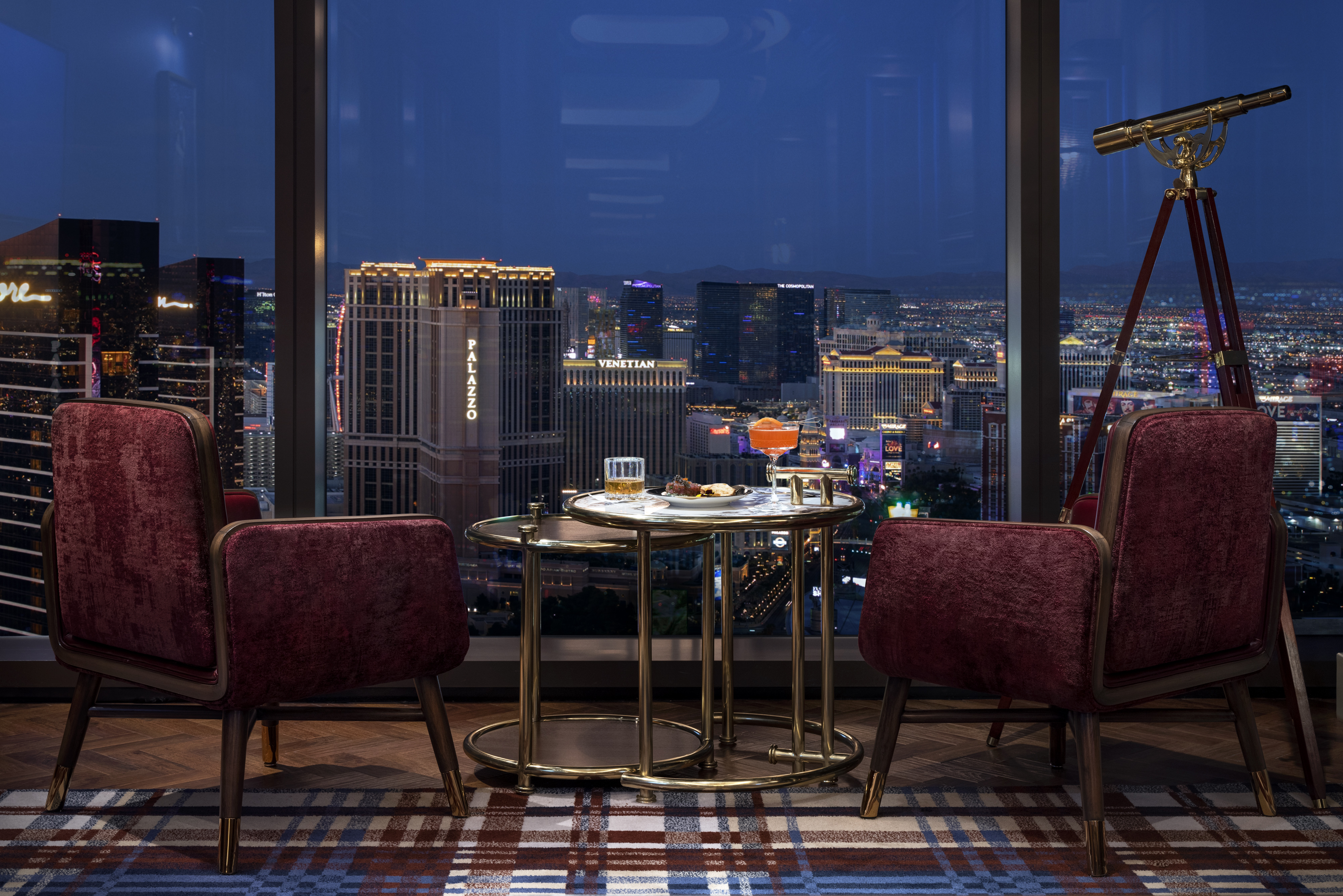 Two lounge chairs overlooking a view of Las Vegas 