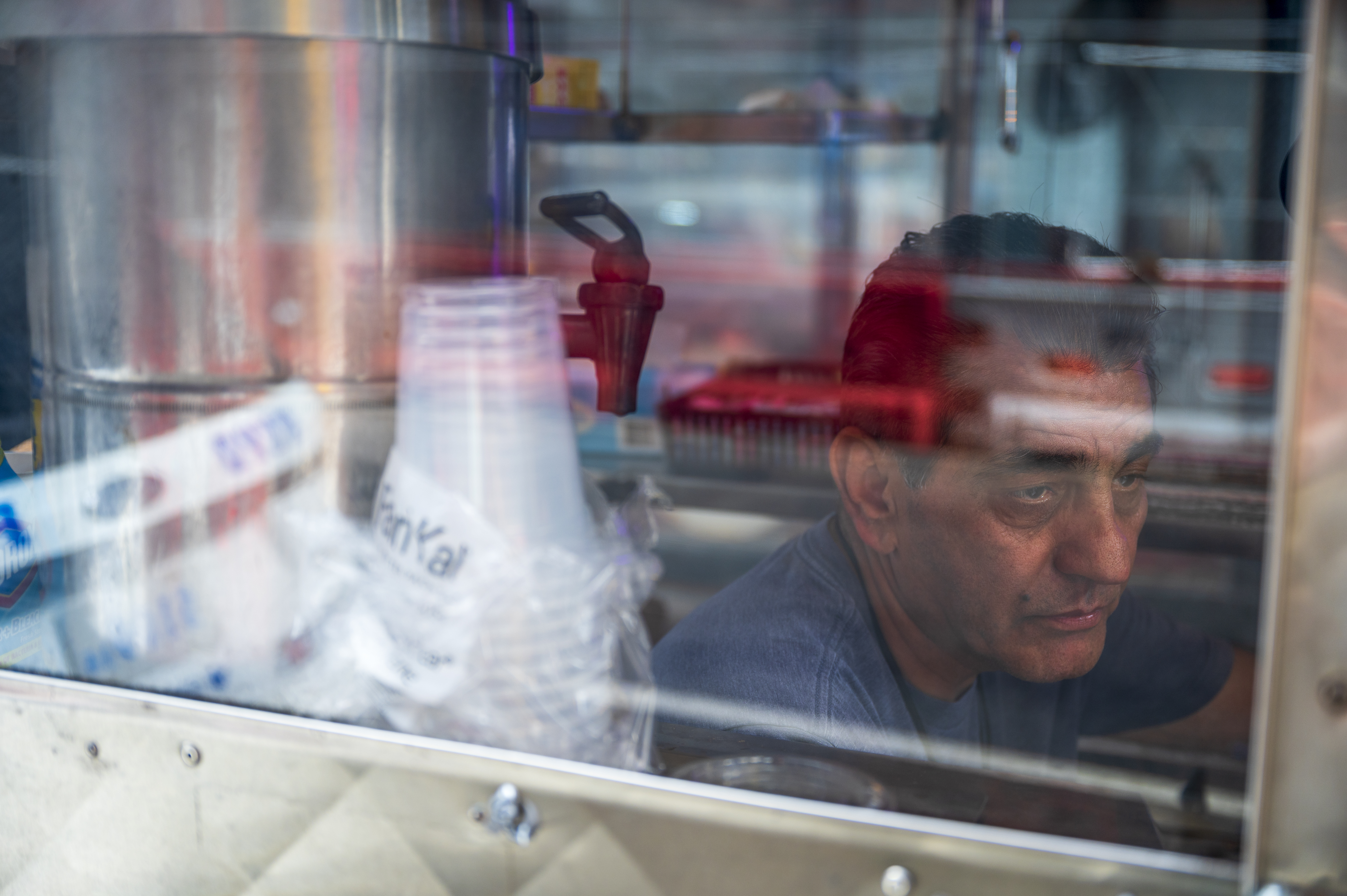 Afghanistan-born Bashir Saleh, 64, in his coffee and pastries food cart on West 43rd Street.
