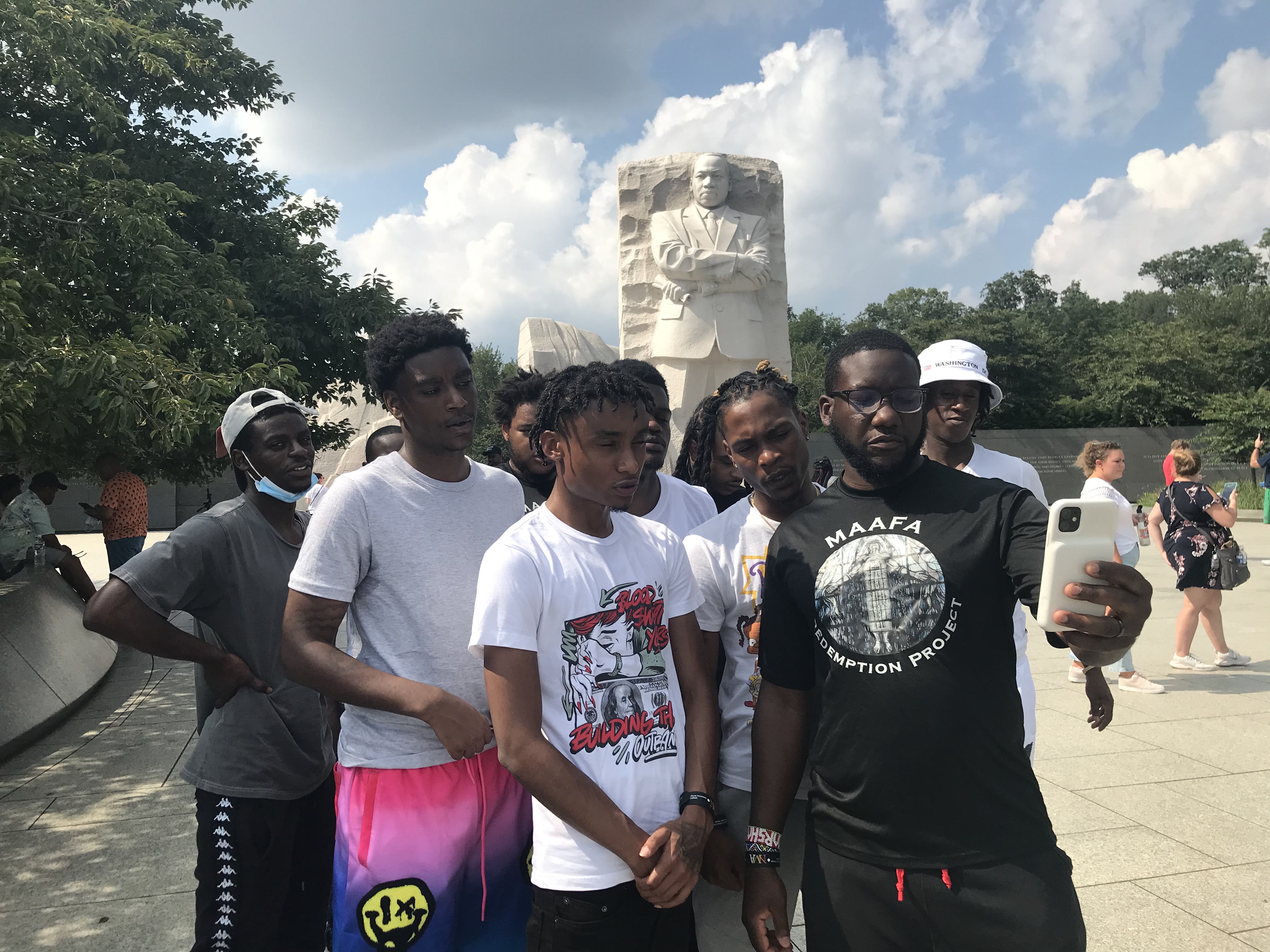 Rev Marshall Hatch Jr., executive director of Maafa Redemption Project and a pastor at New Mount Pilgrim Church in West Garfield Park, with several young men participating in Maafa who traveled to Washington, D.C., to participate in a voting rights march and rally on Saturday.