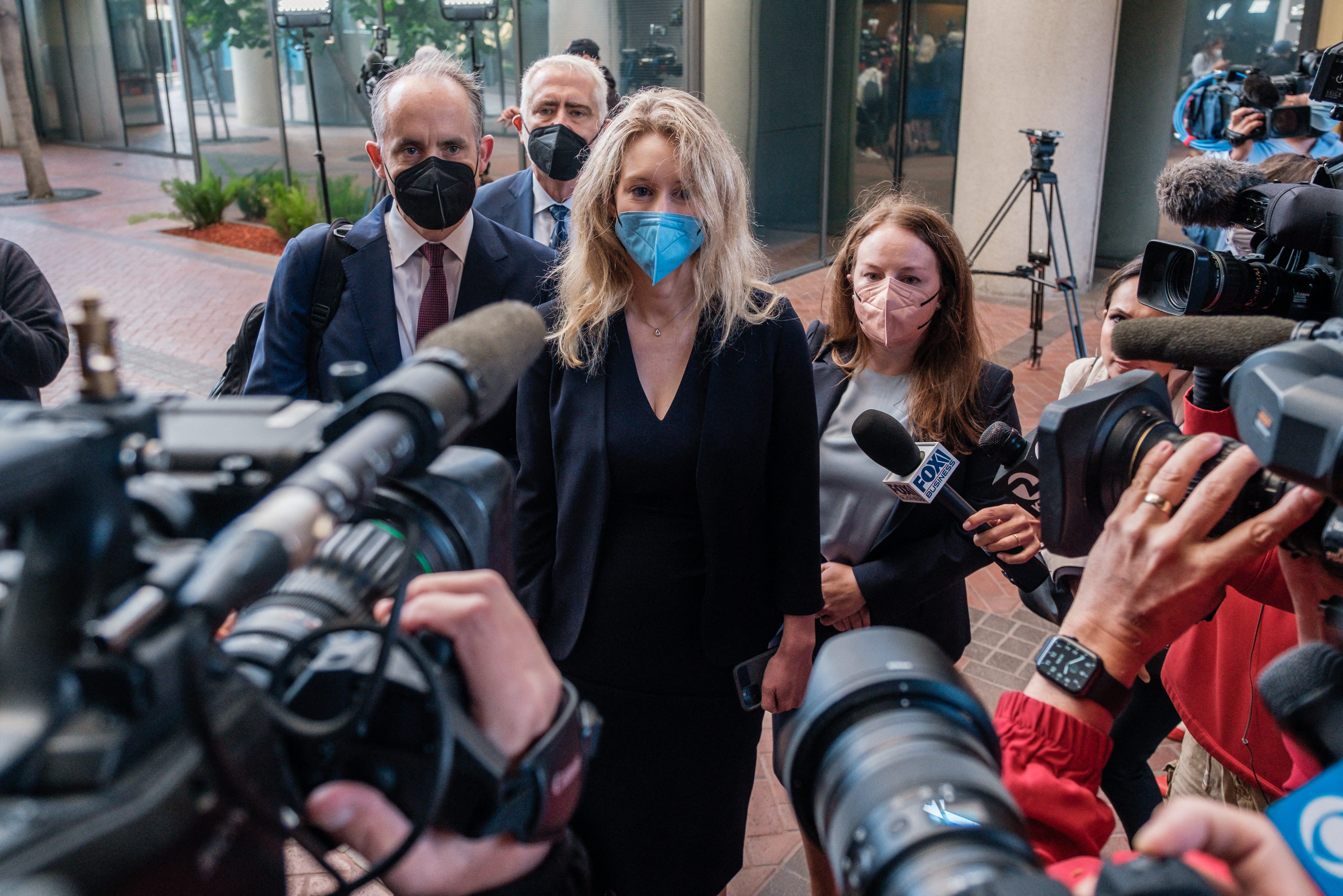Elizabeth Holmes addresses the media outside of a federal courthouse in San Jose, California.